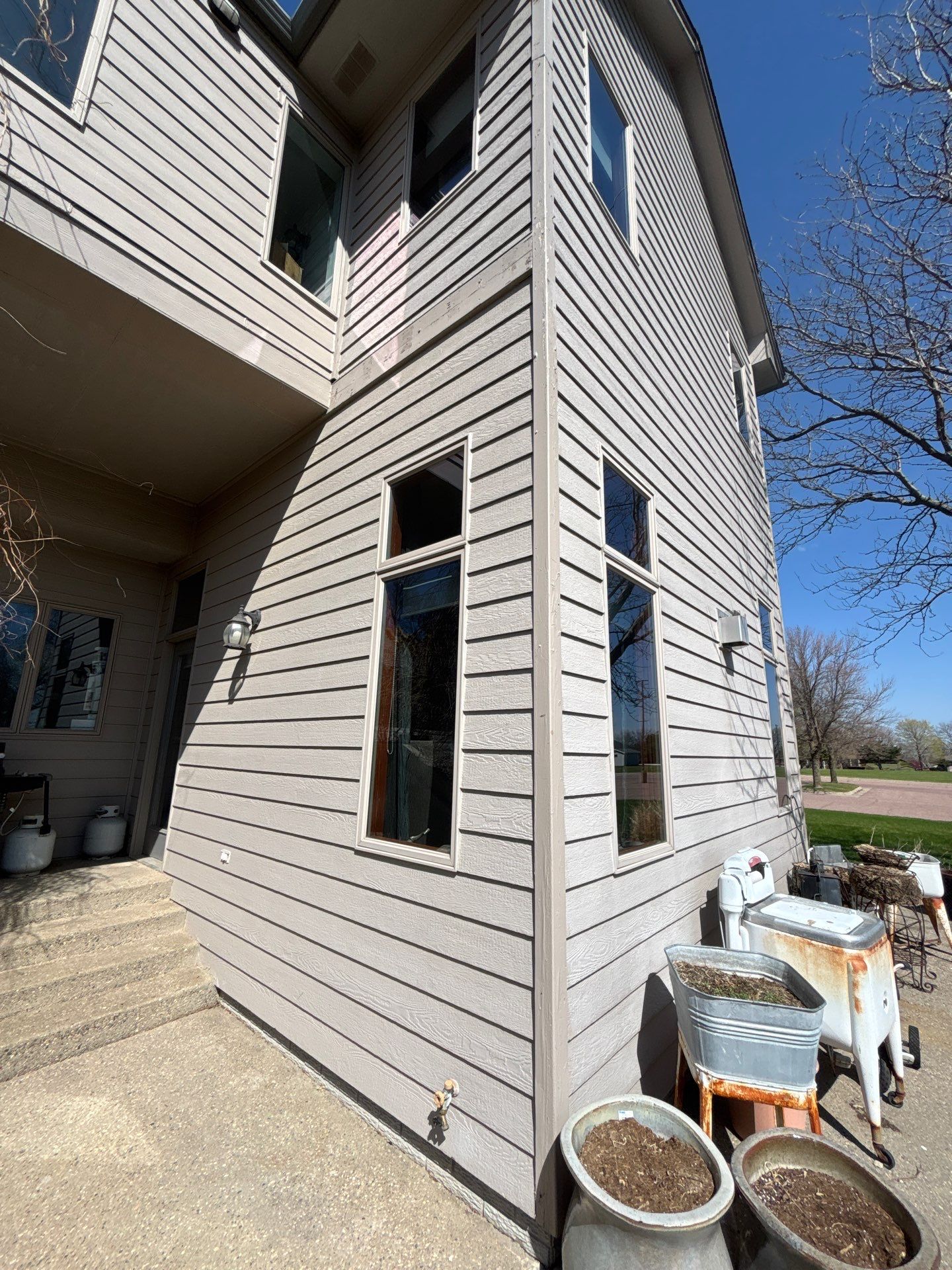 Exterior Siding and Trim Painting for Sioux Falls Residence by Select Painting, Coatings & Garage Cabinets