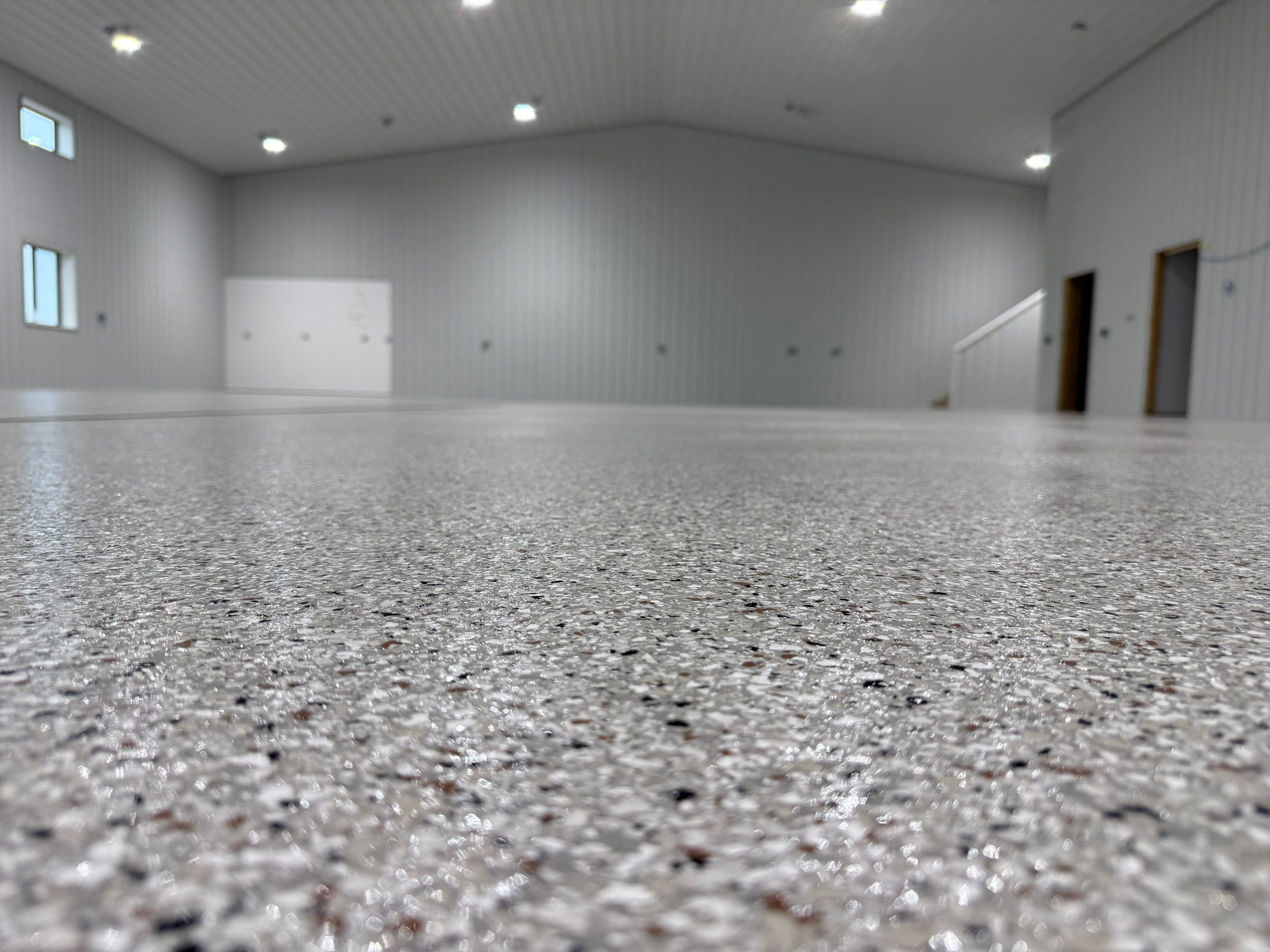 Custom Speckled Floor Coating for Large Montrose Shop by Select Painting, Coatings & Garage Cabinets