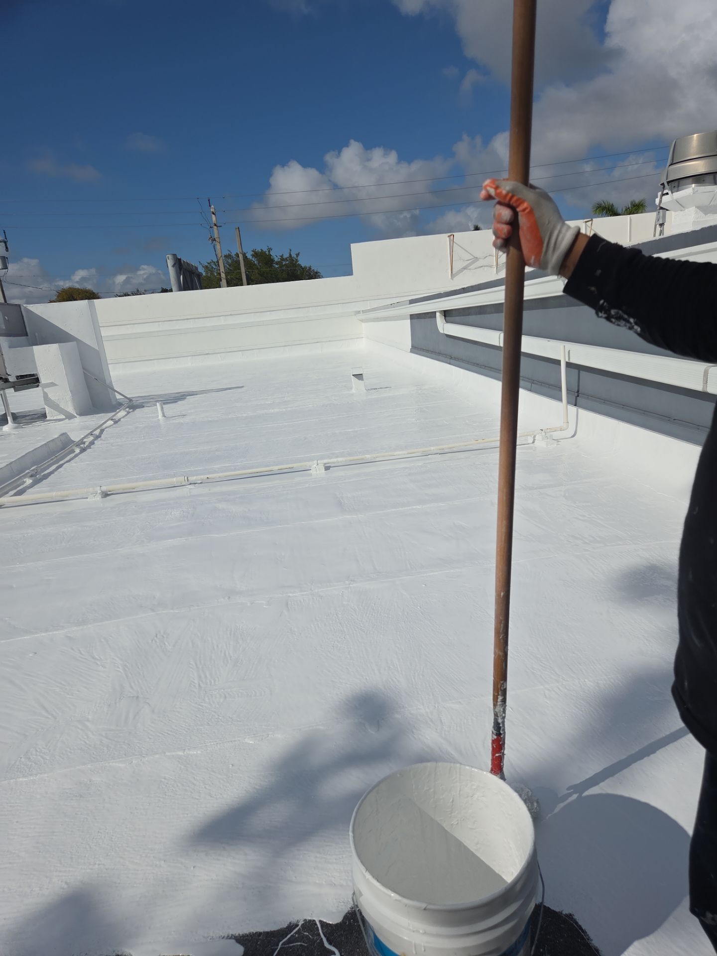 Commercial Flat Roof Restoration Using Silicone Coating in Hallandale Beach by Aastro Roofing