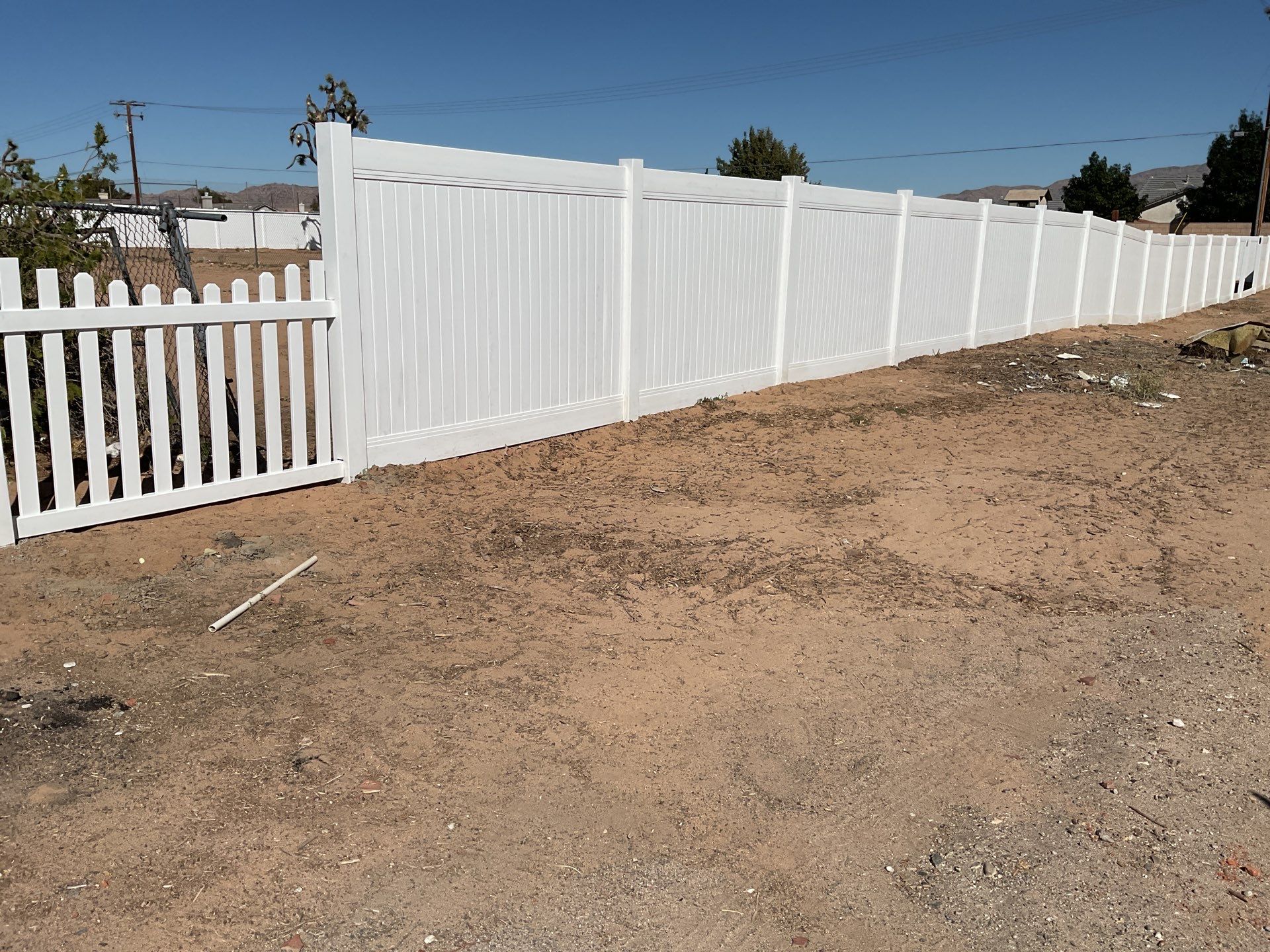 White picket fence  by Fence Guys Inc. 