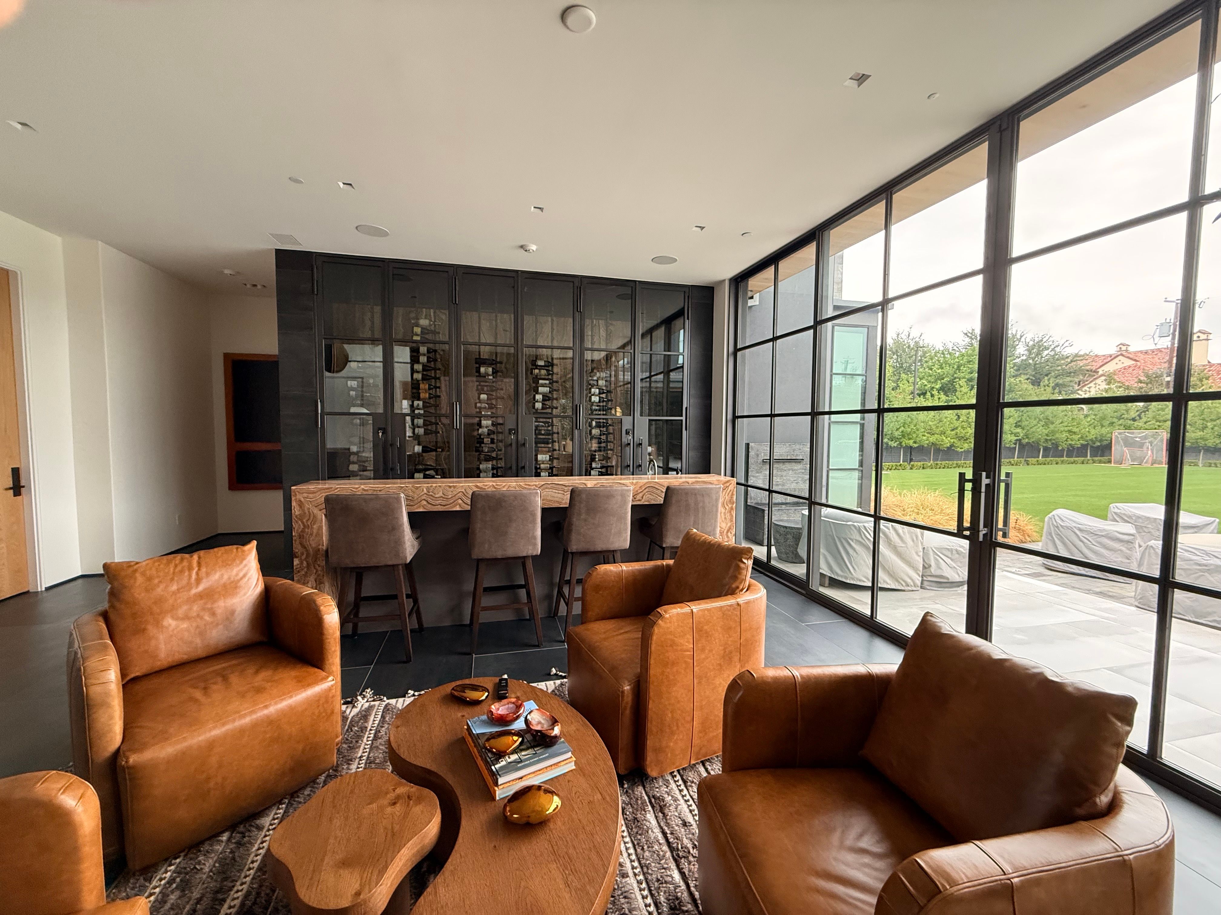 Custom Black-Framed Glass Wine Cellar Installation in Dallas by Solara Custom Living