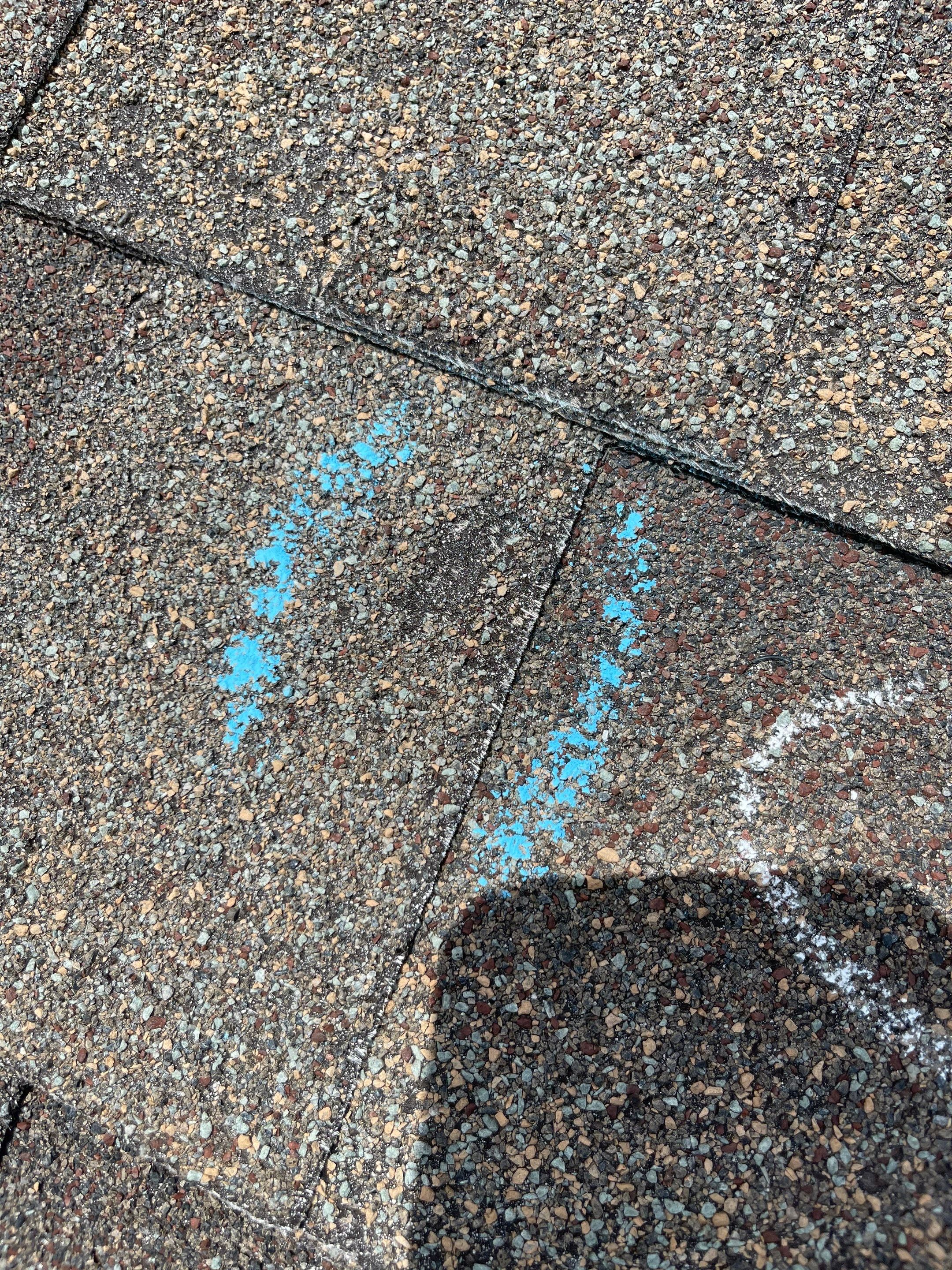 Hail Damage on a Roofing System by Icon Roofing And Construction 