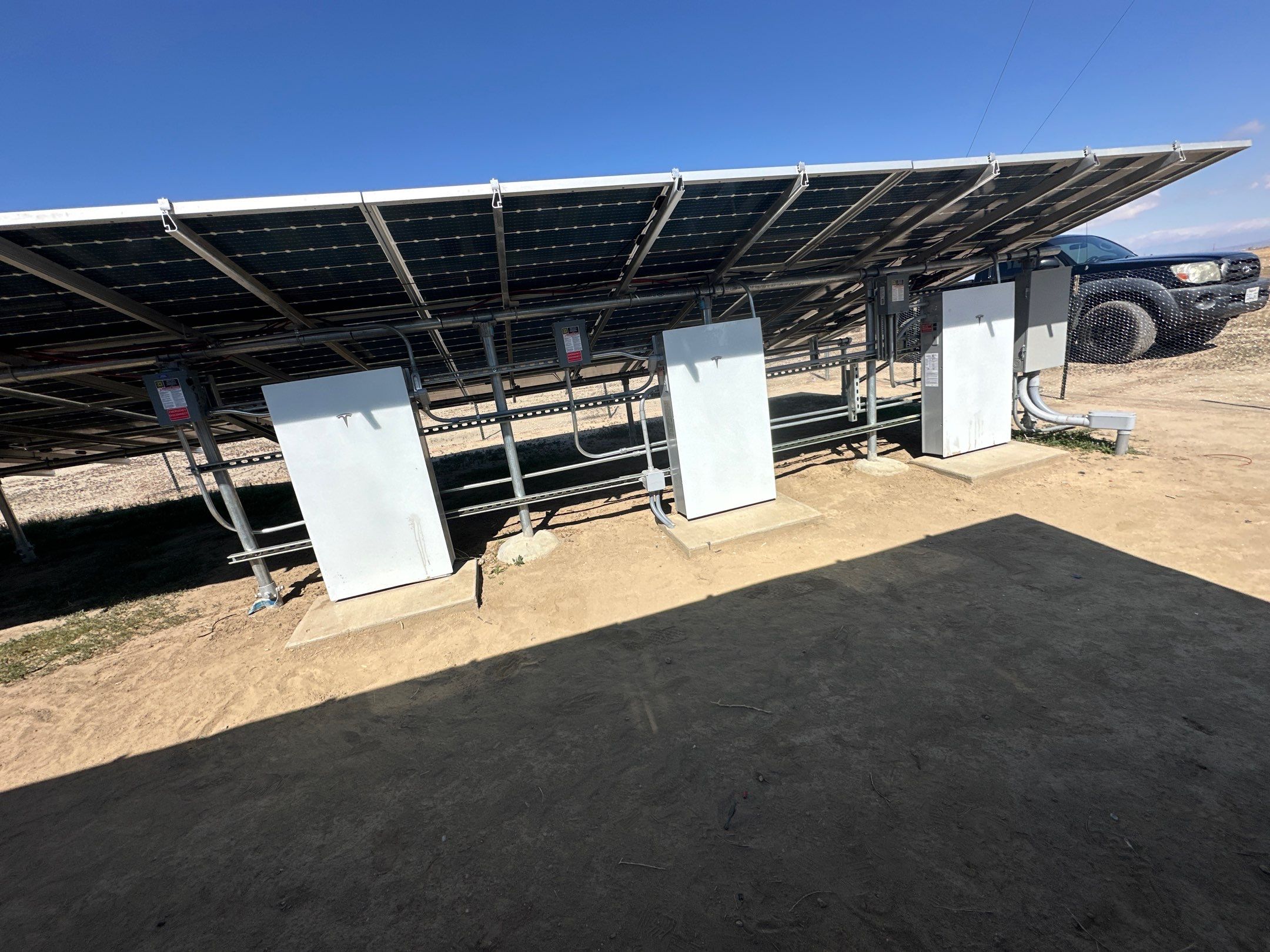 Large-Scale Ground-Mount Solar and Tesla Powerwall Battery Installation by AWS Solar