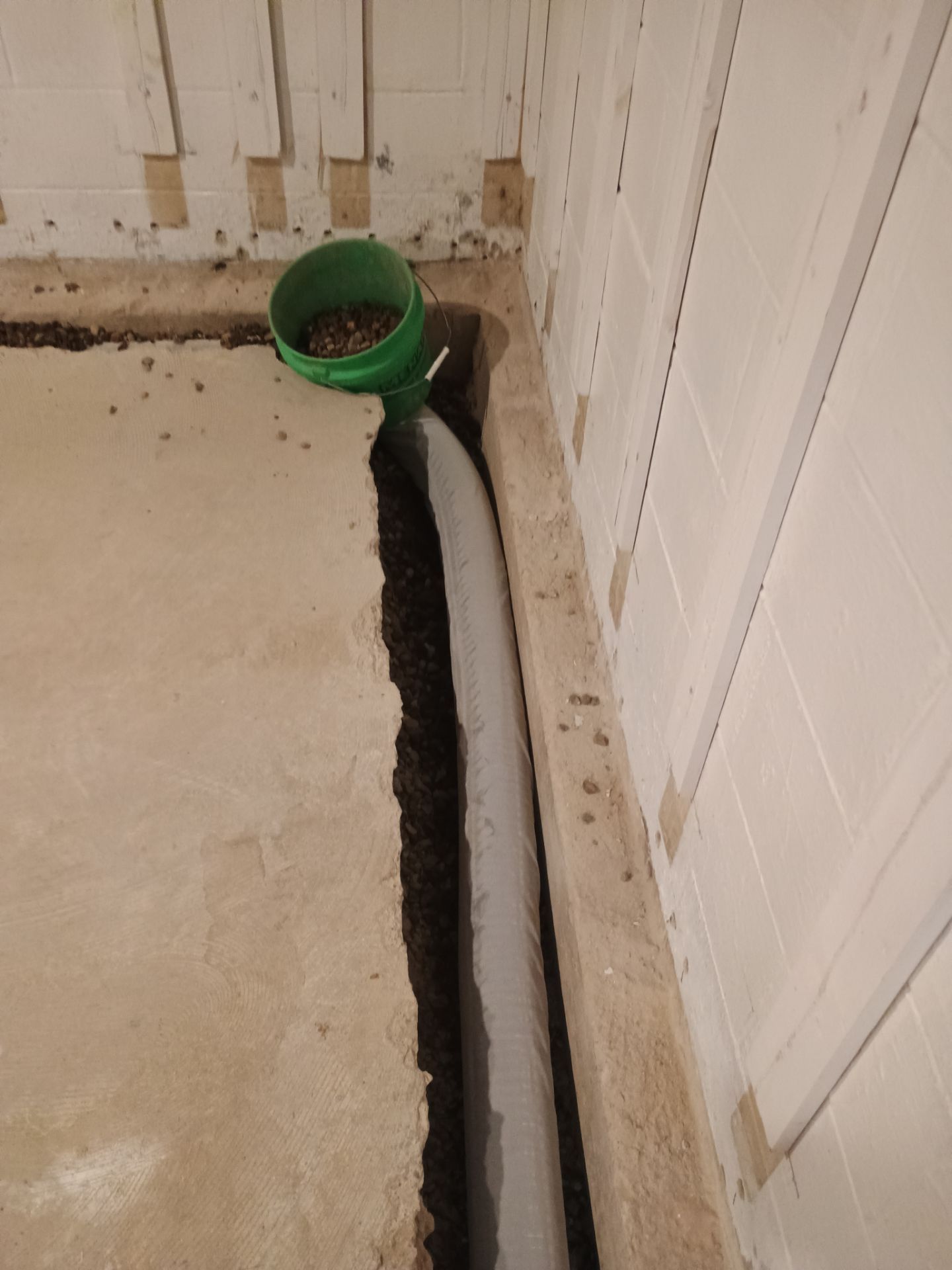 Interior Drain Tile & Buried Discharge in St. Anthony, MN by Waterproofing Northeast
