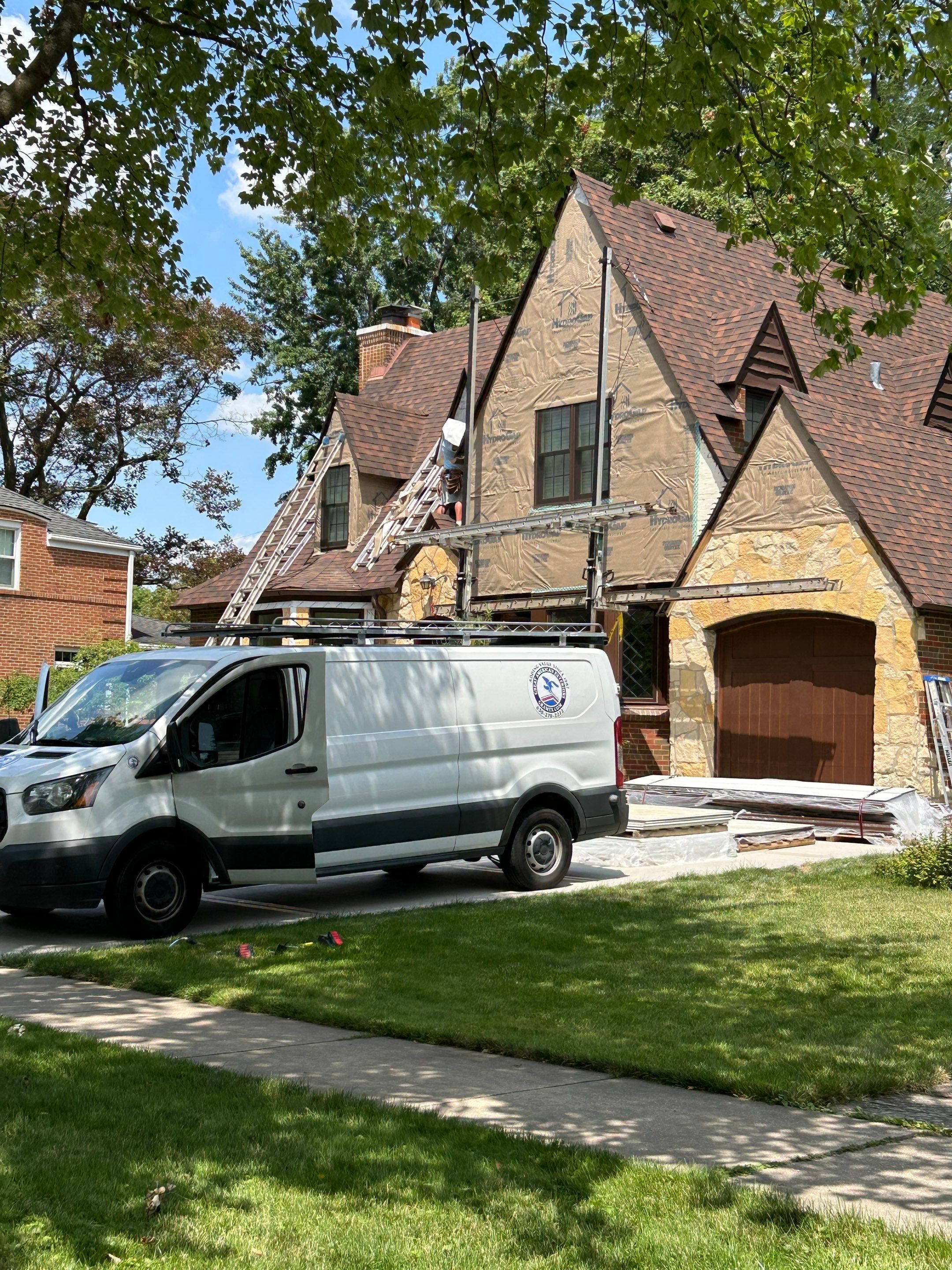 Tudor-Style Hardie Exterior Renovation in Elmhurst by Great American Exteriors