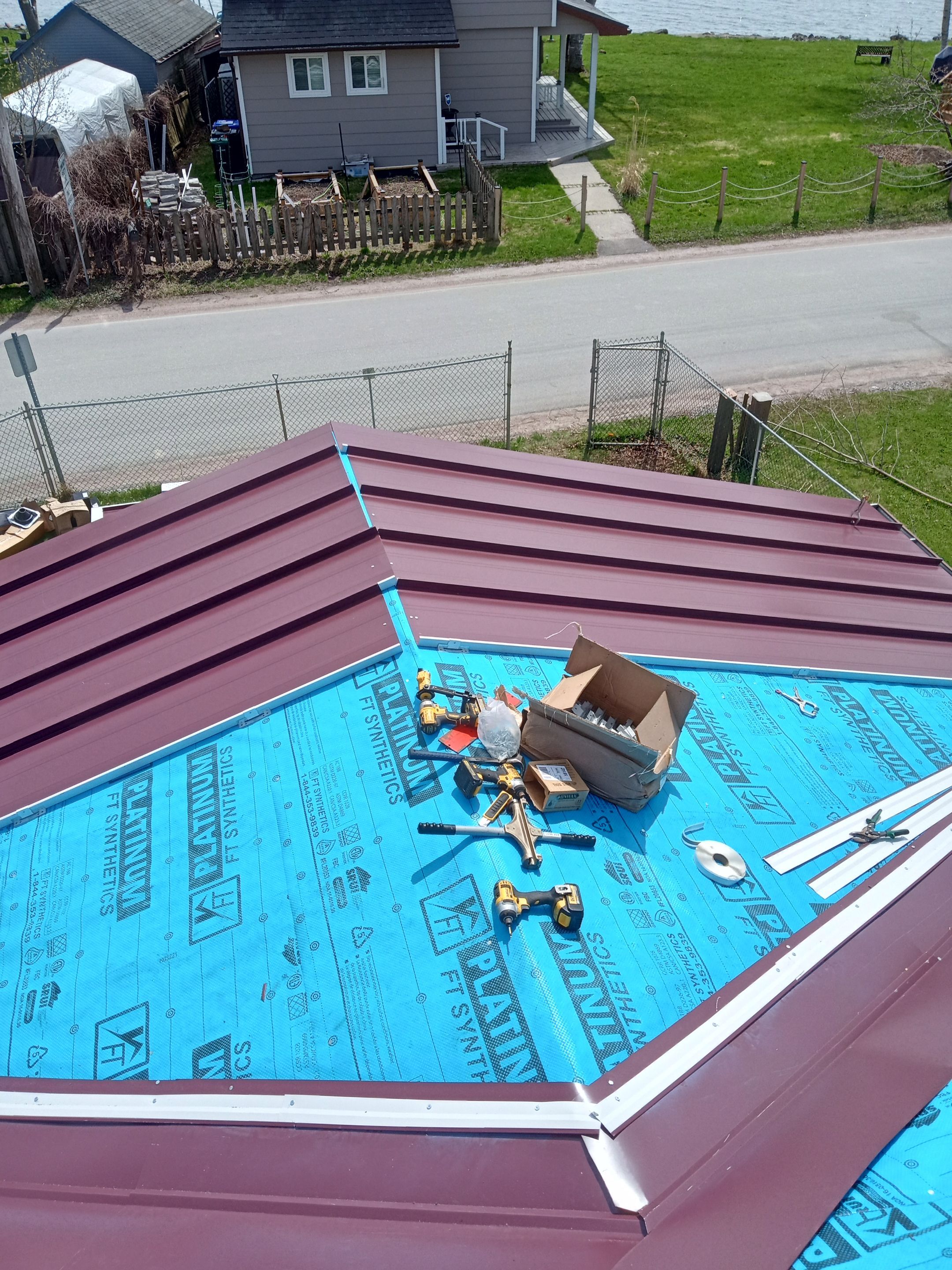 Residential Roofing Installation using 16" Standing Seam Panels by Jay Carter Roofing & Sheet Metal
