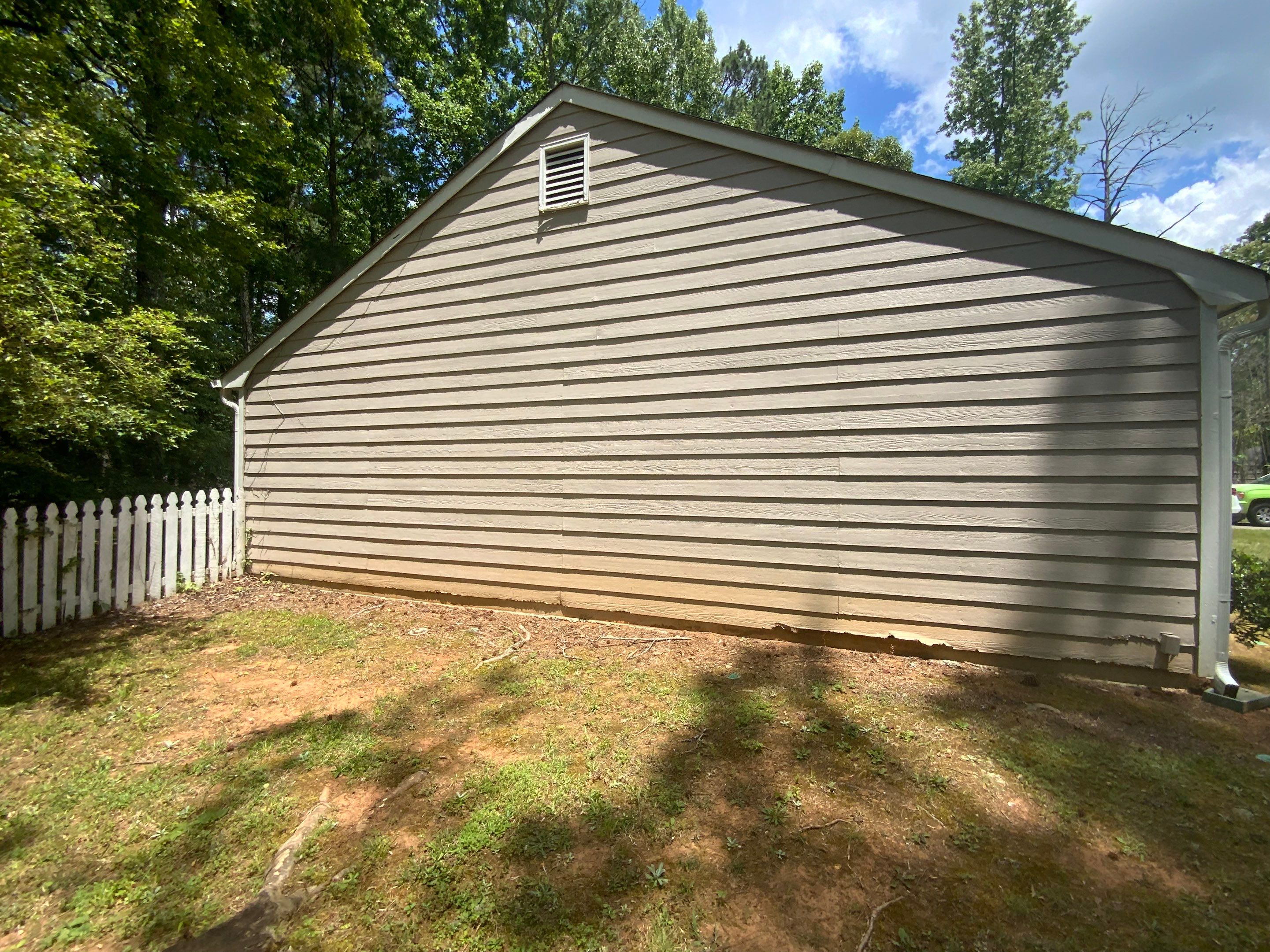 Exterior Siding Painting and Picket Fence Installation in Powder Springs by Swift Home Renovations