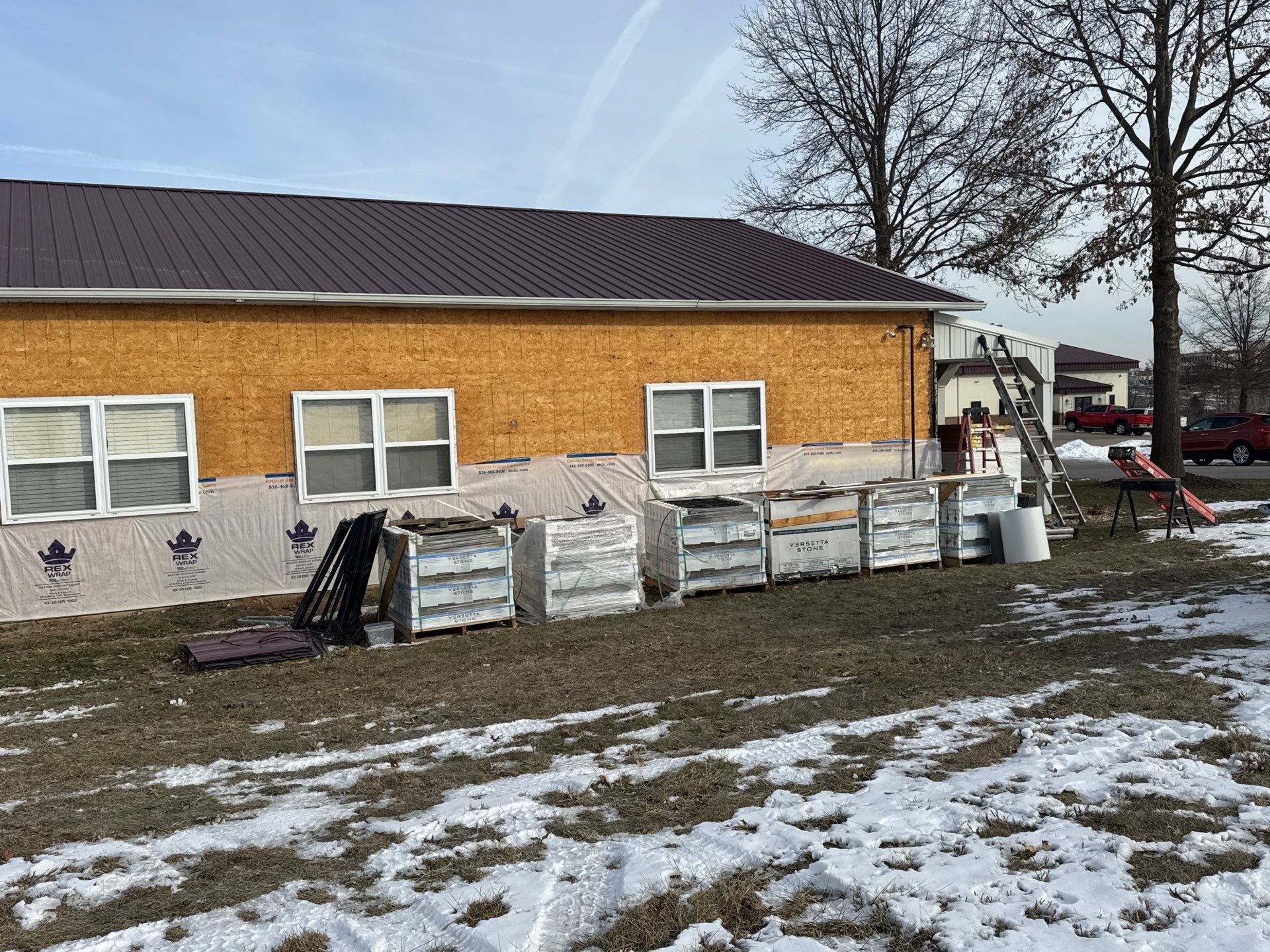 Siding and Stone Installation using Extrerior Porfolio Vinyl Siding and Versetta Stone by EEC  Windows, Siding & Roofing 