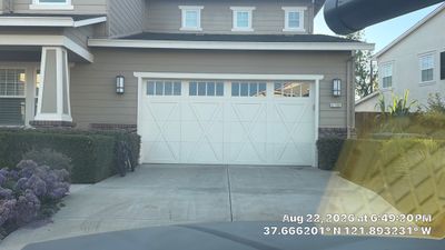 White Carriage-Style Garage Door Installation with Decorative Windows in Pleasanton
