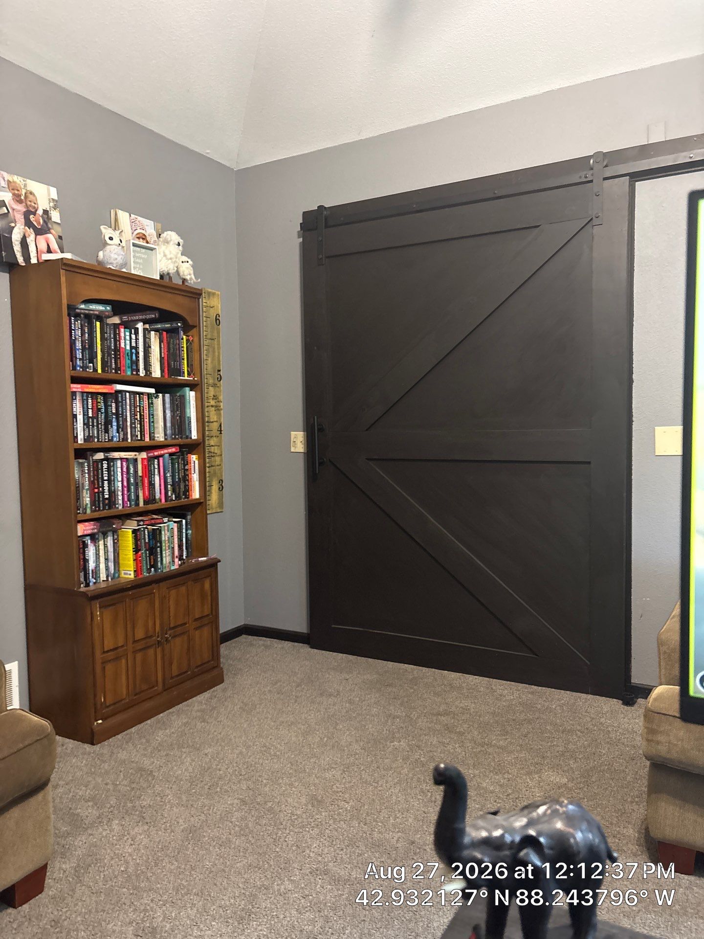 Dark-Stained Wood Sliding Barn Door Installation in Waukesha by CompanyCam Sales Demo