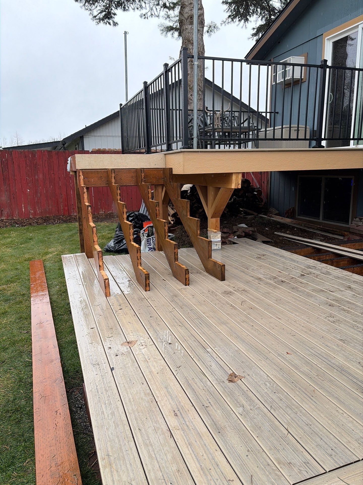 Add a platform deck below an existing elevated deck that was there prior by Home Helpers General Contracting