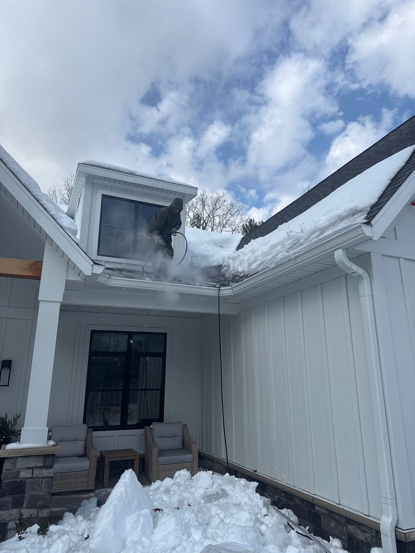 Residential Ice Dam Removal in Traverse City by Rainbow Seamless Systems