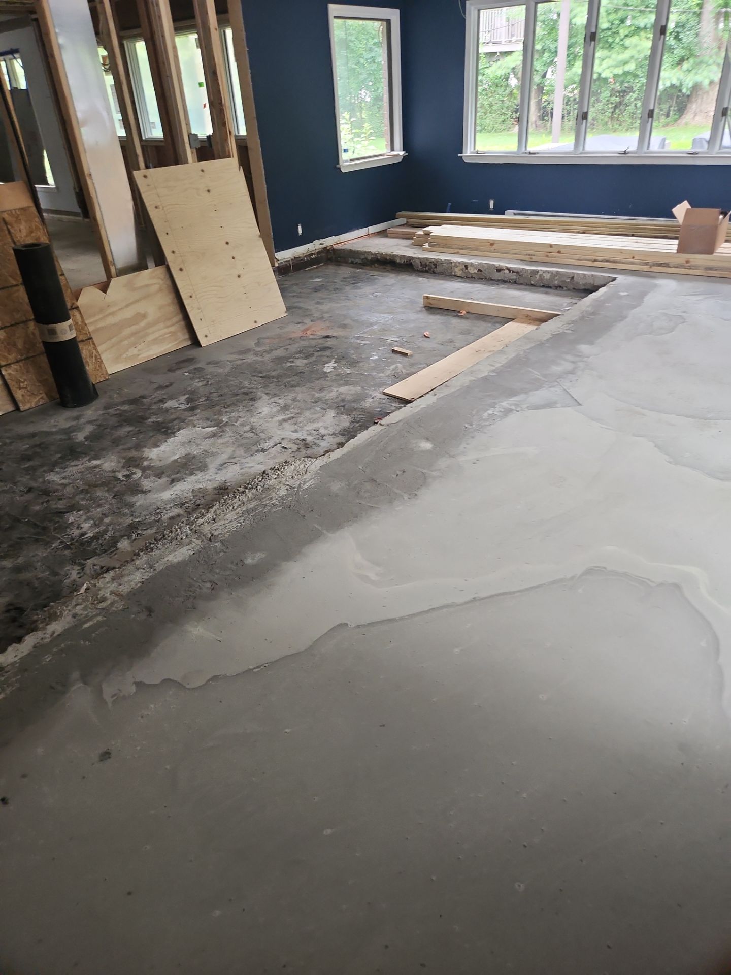 New Flooring installation using 4" White oak select grade plain sawn Ebony Stain by Ann Arbor Hardwoods