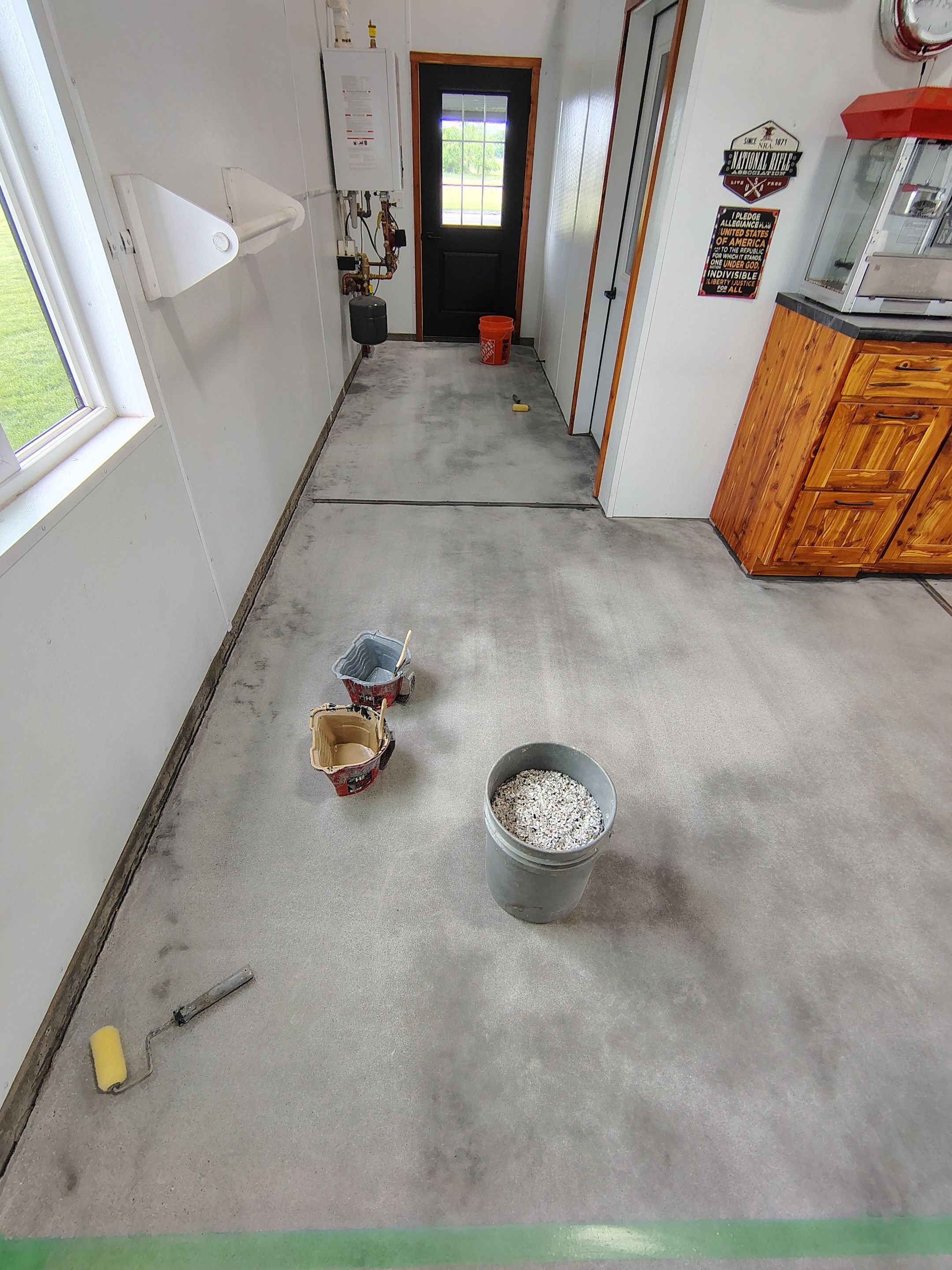 Multi-Stage Concrete Floor Coating for Egan Shop and RV Storage by Select Painting, Coatings & Garage Cabinets