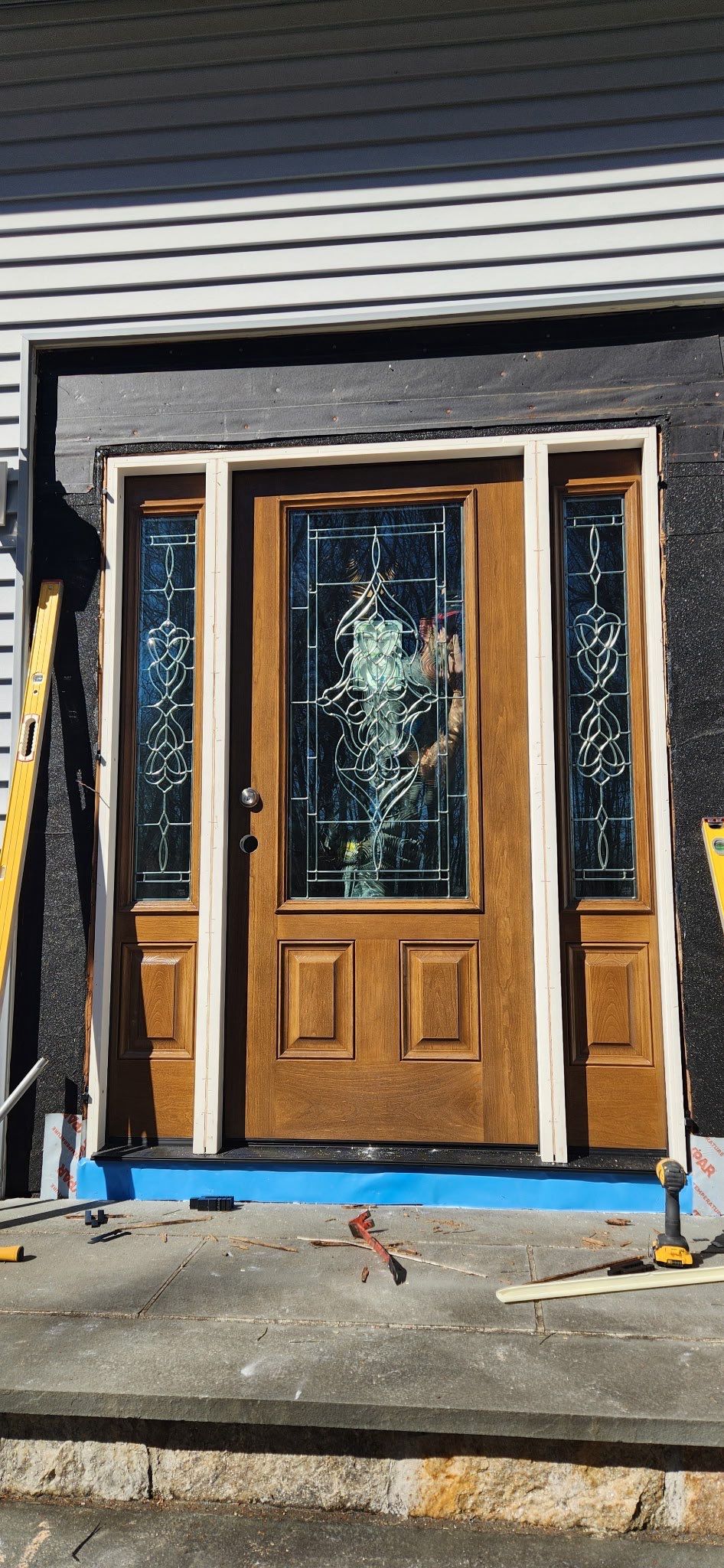 Front Entry Transformation with Decorative Glass Doors by DiGiorgi Roofing and Siding Inc