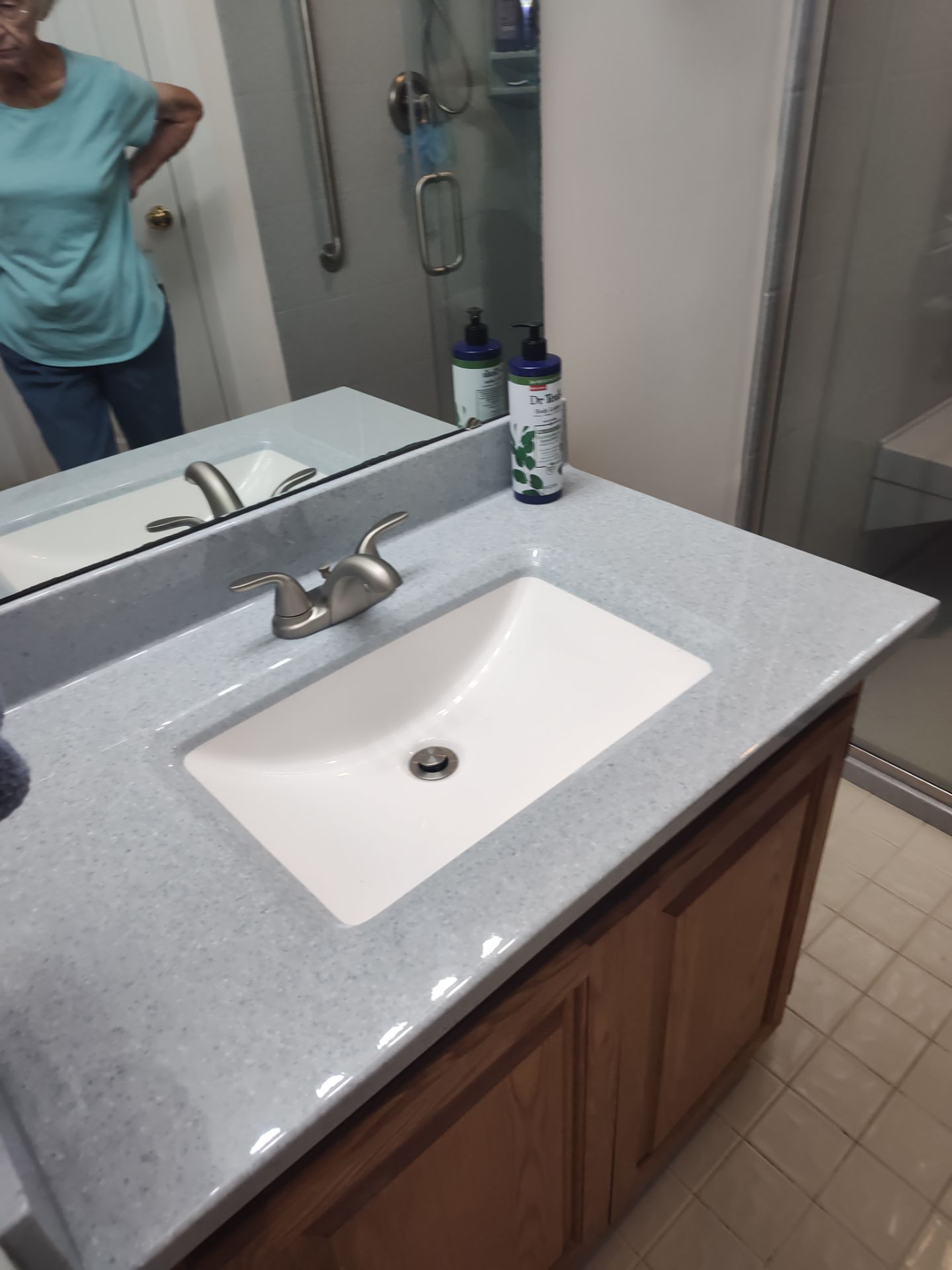 Bathroom Remodel using Onyx base and shower walls with seat & caddie by Cornerstone Home Builders, LLC