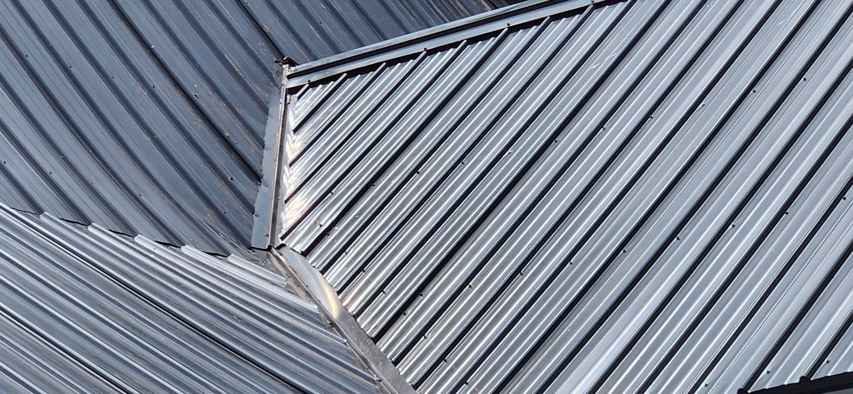 Residential Roofing Installation using 26 Gauge Colored Panels by Hostetler Roofing