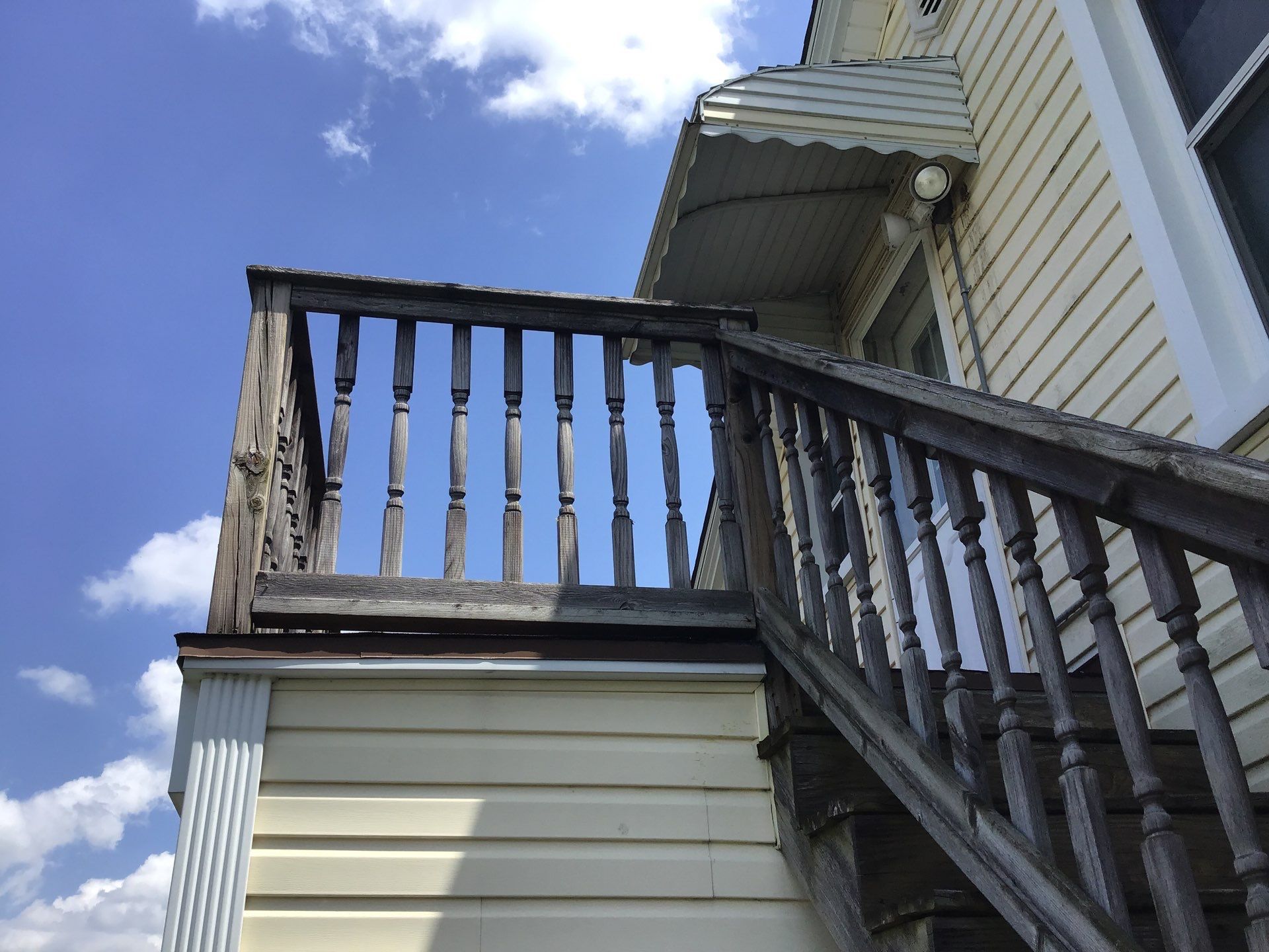Rebuild balcony flat roofing TREX decking stairway and Railings in Wyandotte, MI by Northwest Construction 