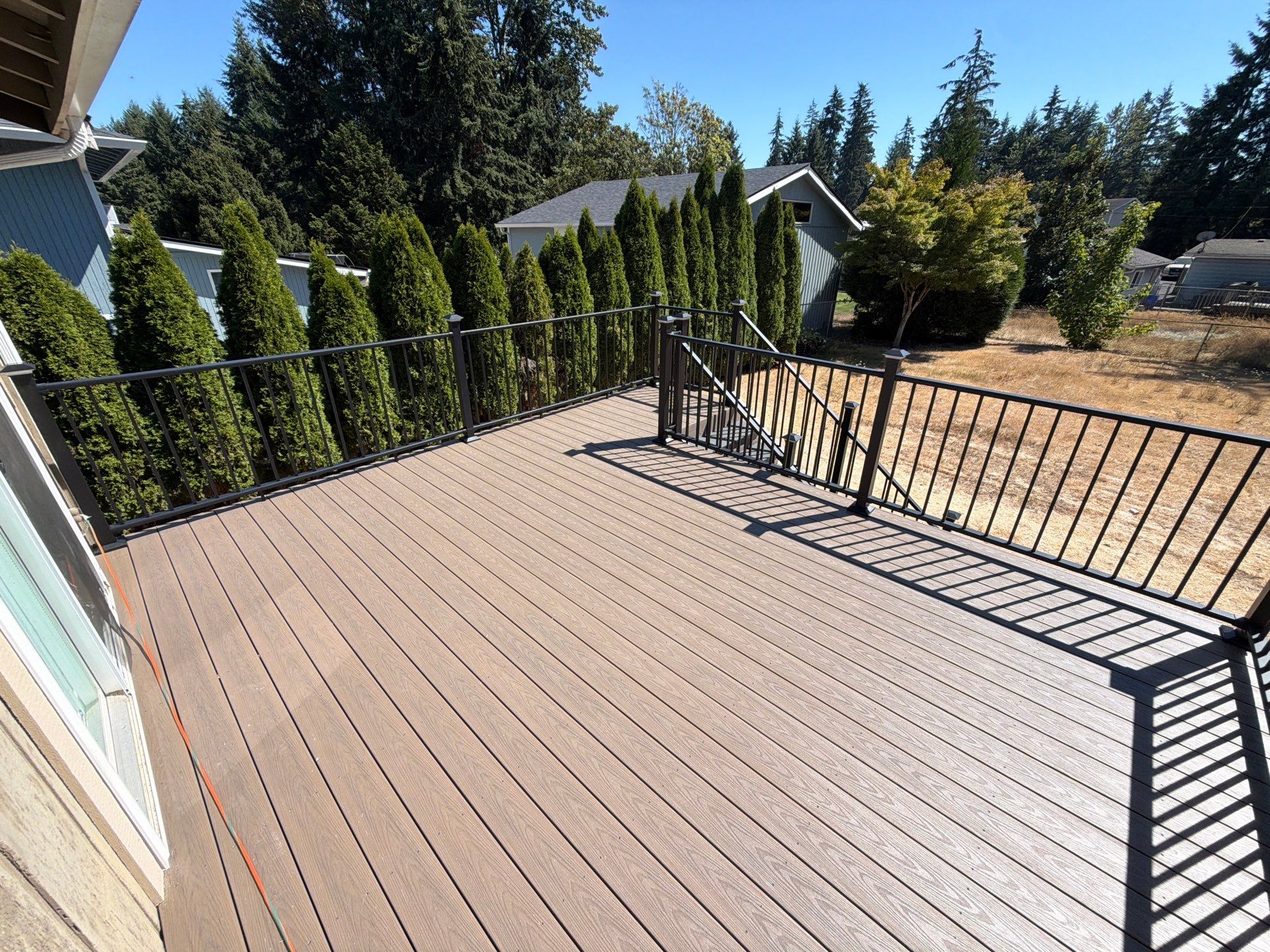 Composite Deck Installation with Black Metal Railings in Bonney Lake by Expedeck