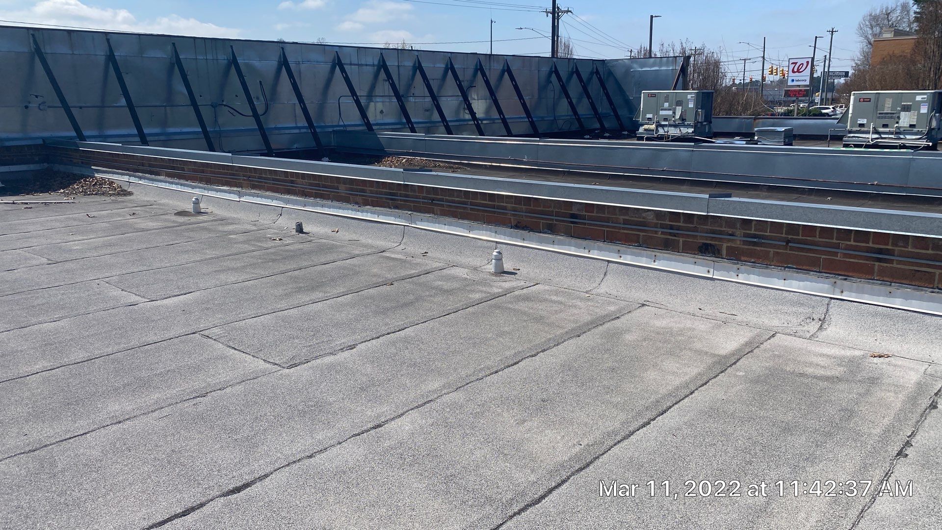 Commercial Roof Coating using Fiberseal basecoat and Silicon Topcoat by Just In Time Roofing and Restoration