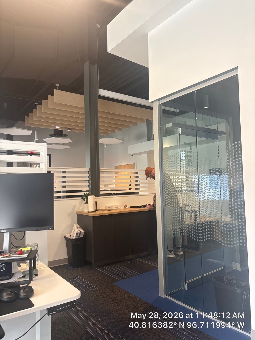 Modern Office Remodel with Acoustic Baffles and Glass Partitions by CompanyCam Sales Demo