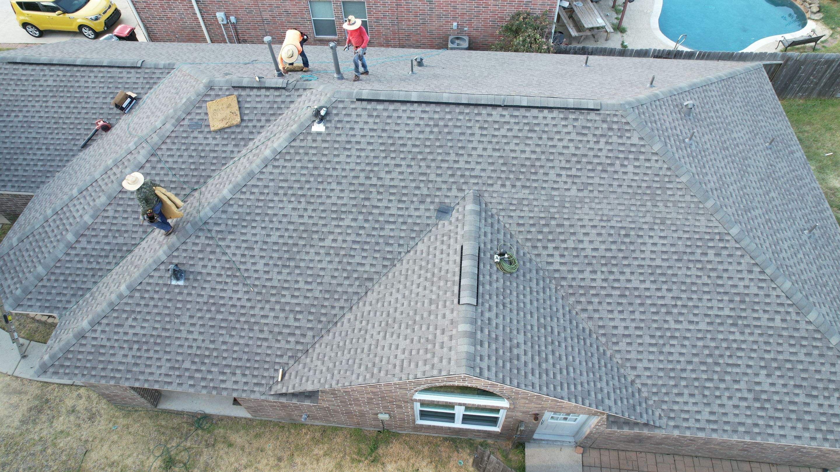 Full Roof Replacement on Two-Story Brick Home — Spring, TX by PL Roofing & SB Roofing, LLC.