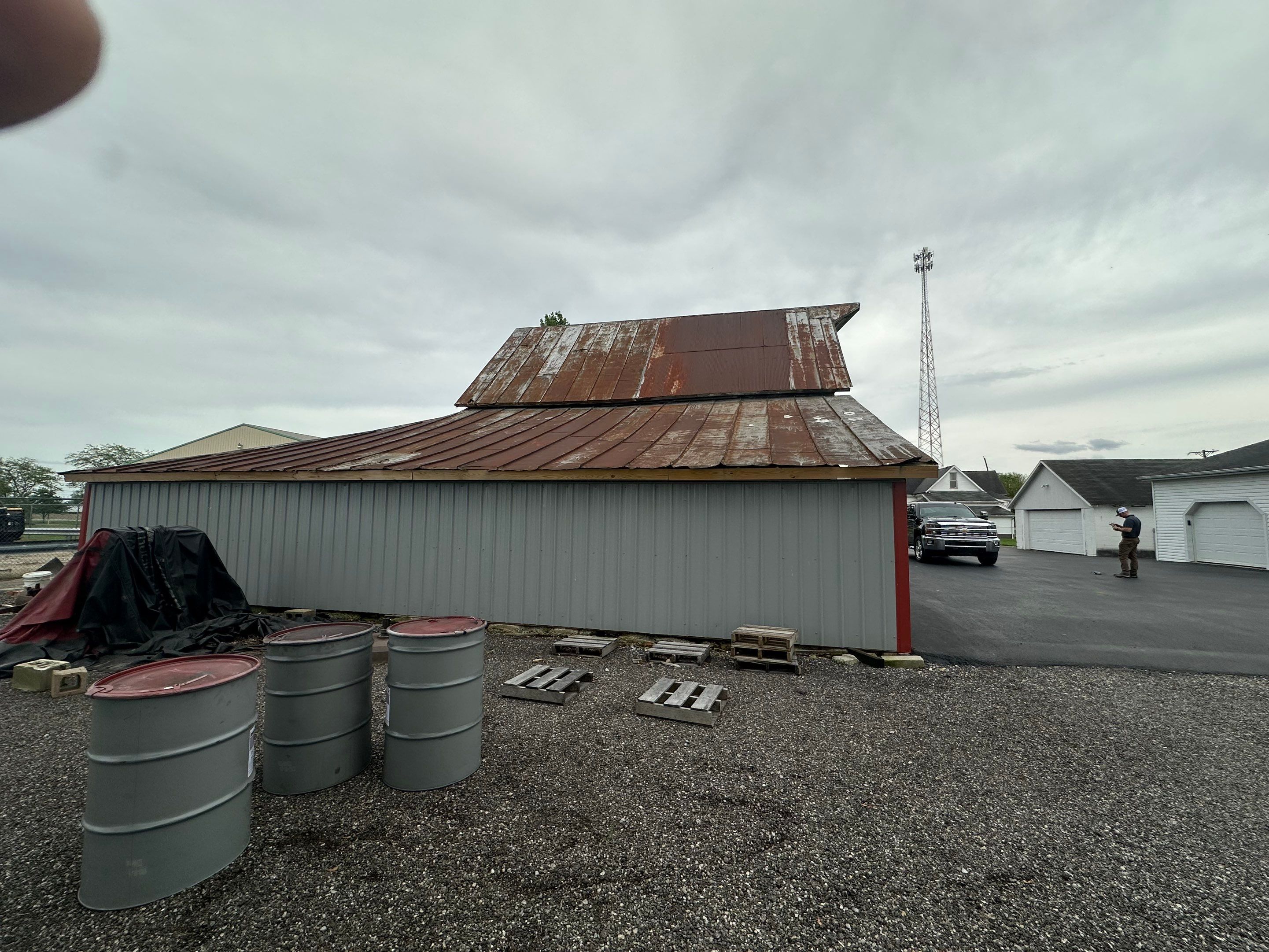 Residential Roofing Installation using Standing Seam Metal - Barn Red by RoofX 
