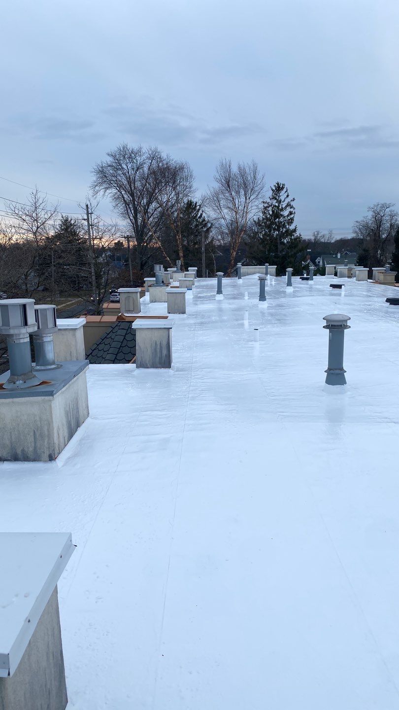 Silicone Coating system on residential complex by Roof Plus