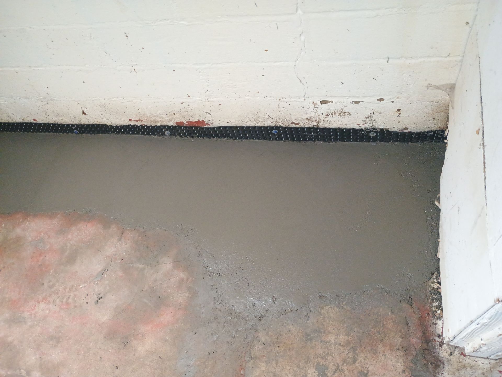 Interior Drain Tile & Sump Pump System in North Minneapolis by Waterproofing Northeast