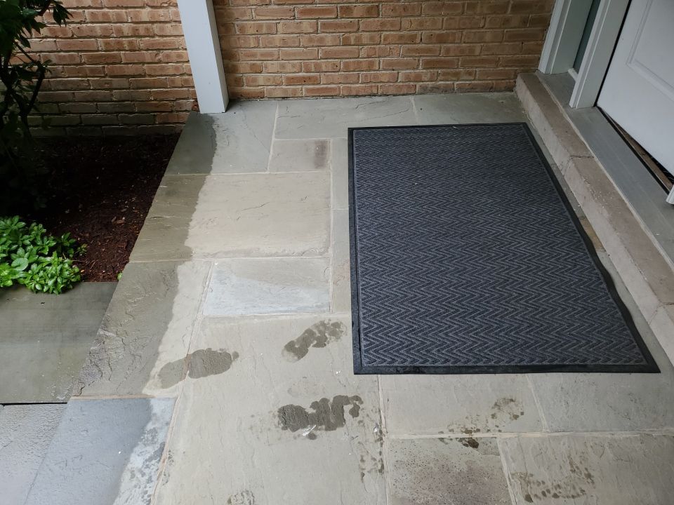 Bluestone patio cleaning by Northern Power Washing LLC.