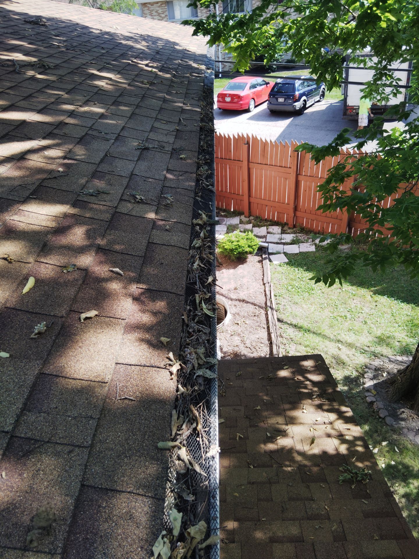 Commercial gutter cleaning Madison before photo with filled gutters