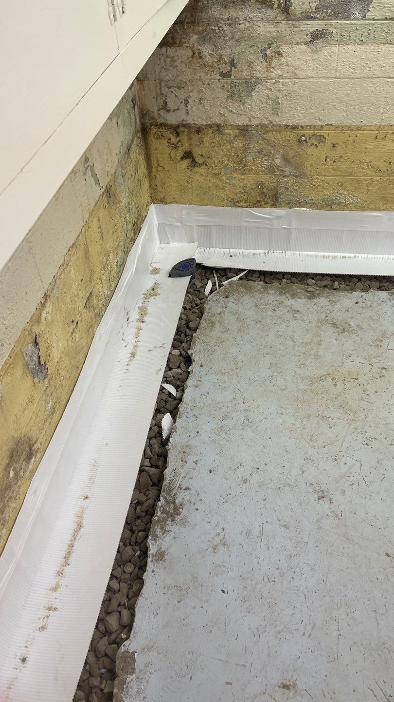 Interior Waterproofing Using GrateDrain™ Products by Toledo Basement Repair