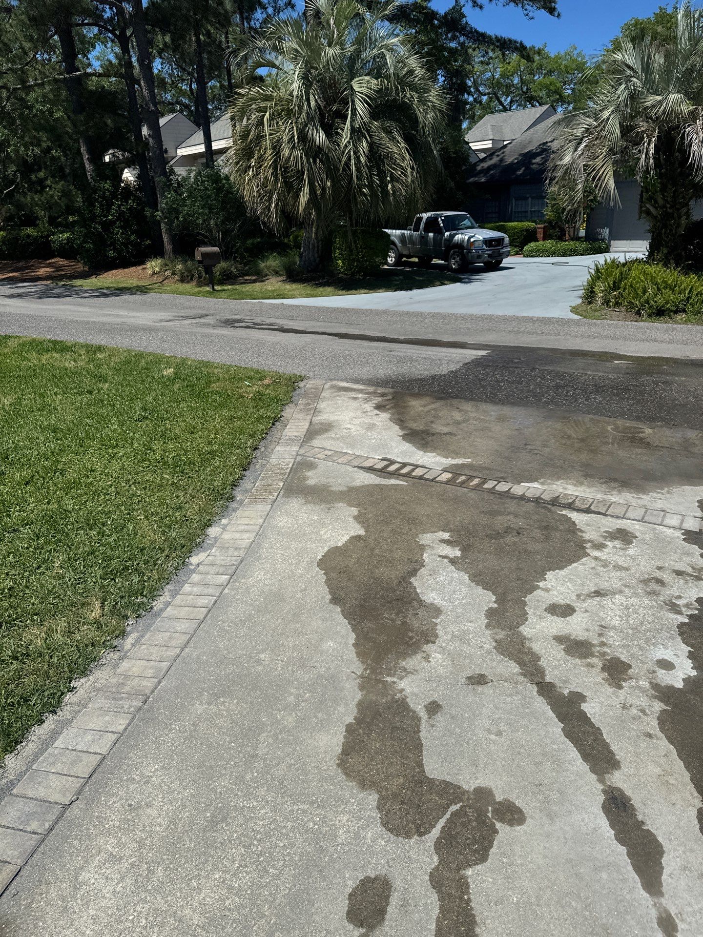 Concrete Driveway Repair with Decorative Paver Accents in Hilton Head Island by Lowcountry Scapes, LLC