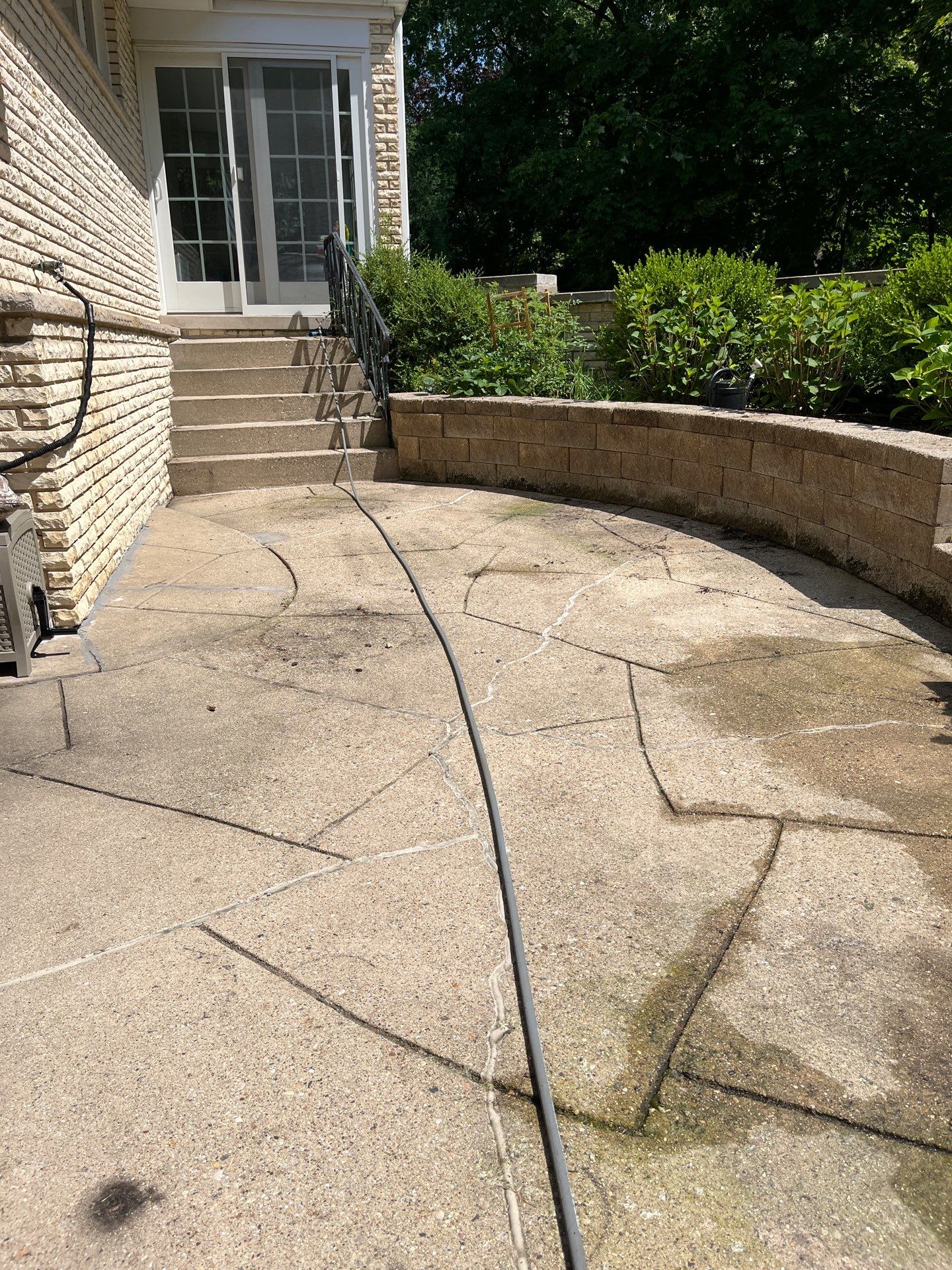 concrete power washing using Algaecide, soft wash soap by Northern Power Washing LLC.