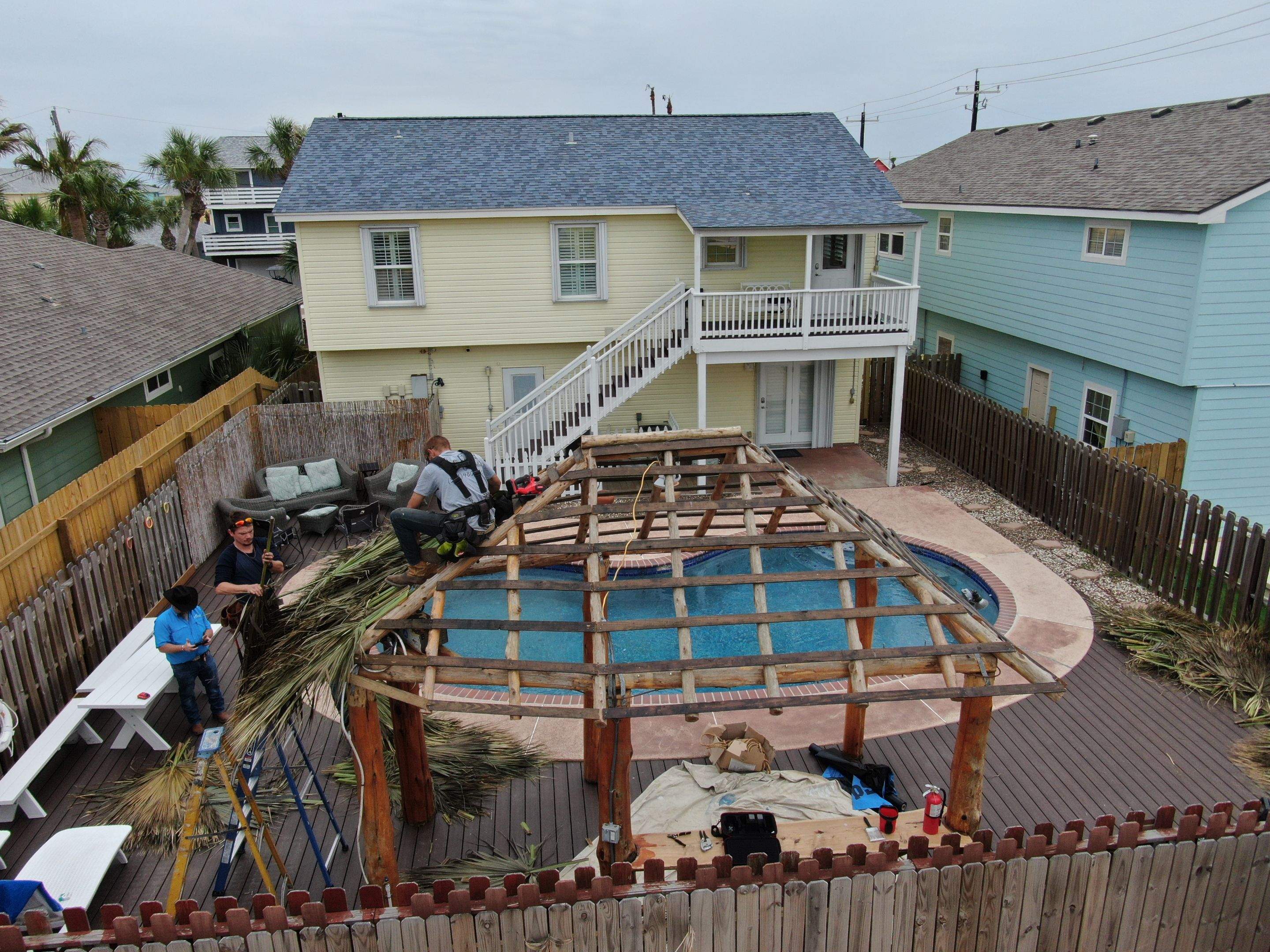 Poolside paradise by Bayfront Roofing and Construction