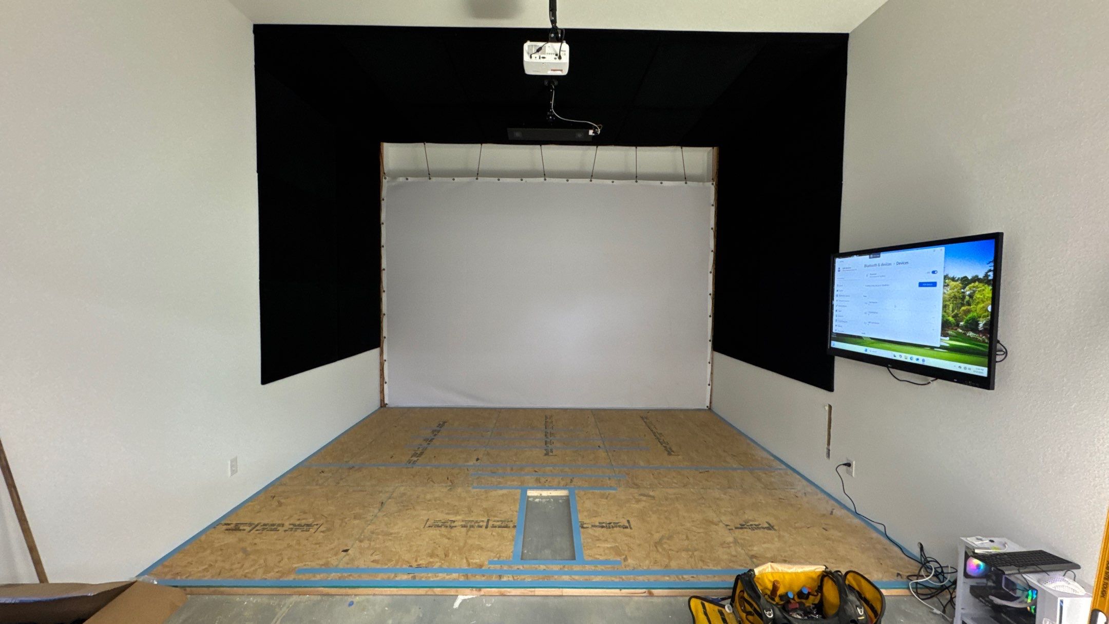 A Custom Golf Sim Made To Fit The Entire Room by Banner Garage
