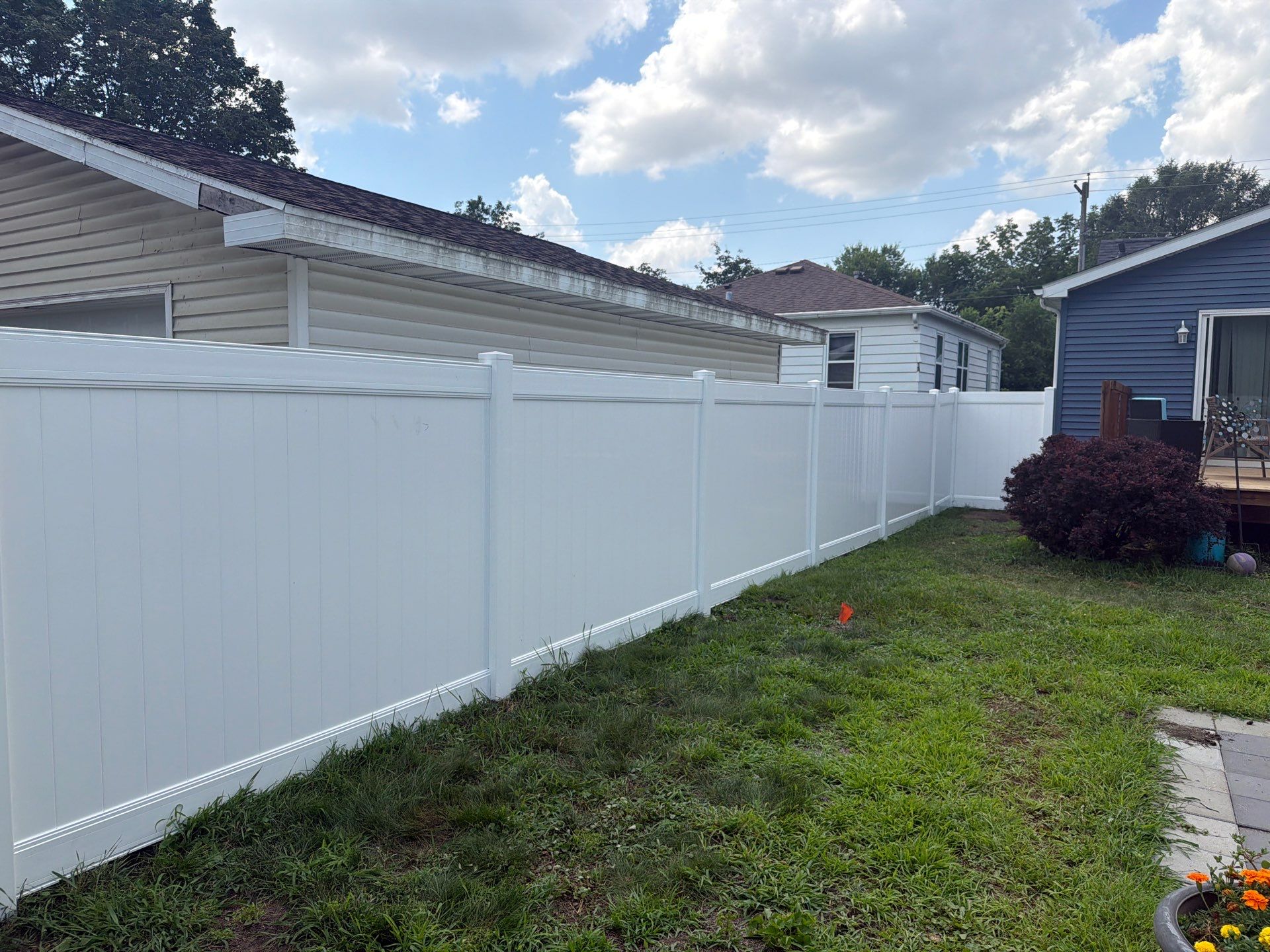 White Vinyl Privacy Fence Installation in Waterloo, Iowa by Perfect Picket Fence and Stain