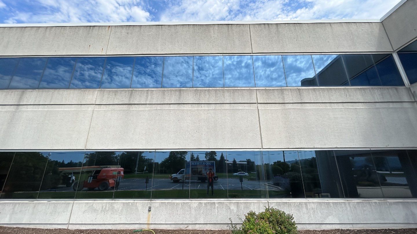 commercial pressure washing using Algaecide, soft wash soap by Northern Power Washing LLC.