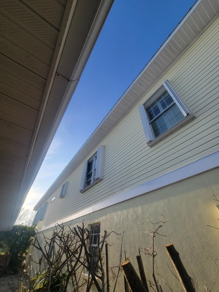 White Gutters with Matching Downspouts in Sarasota FL by Gutter Professors