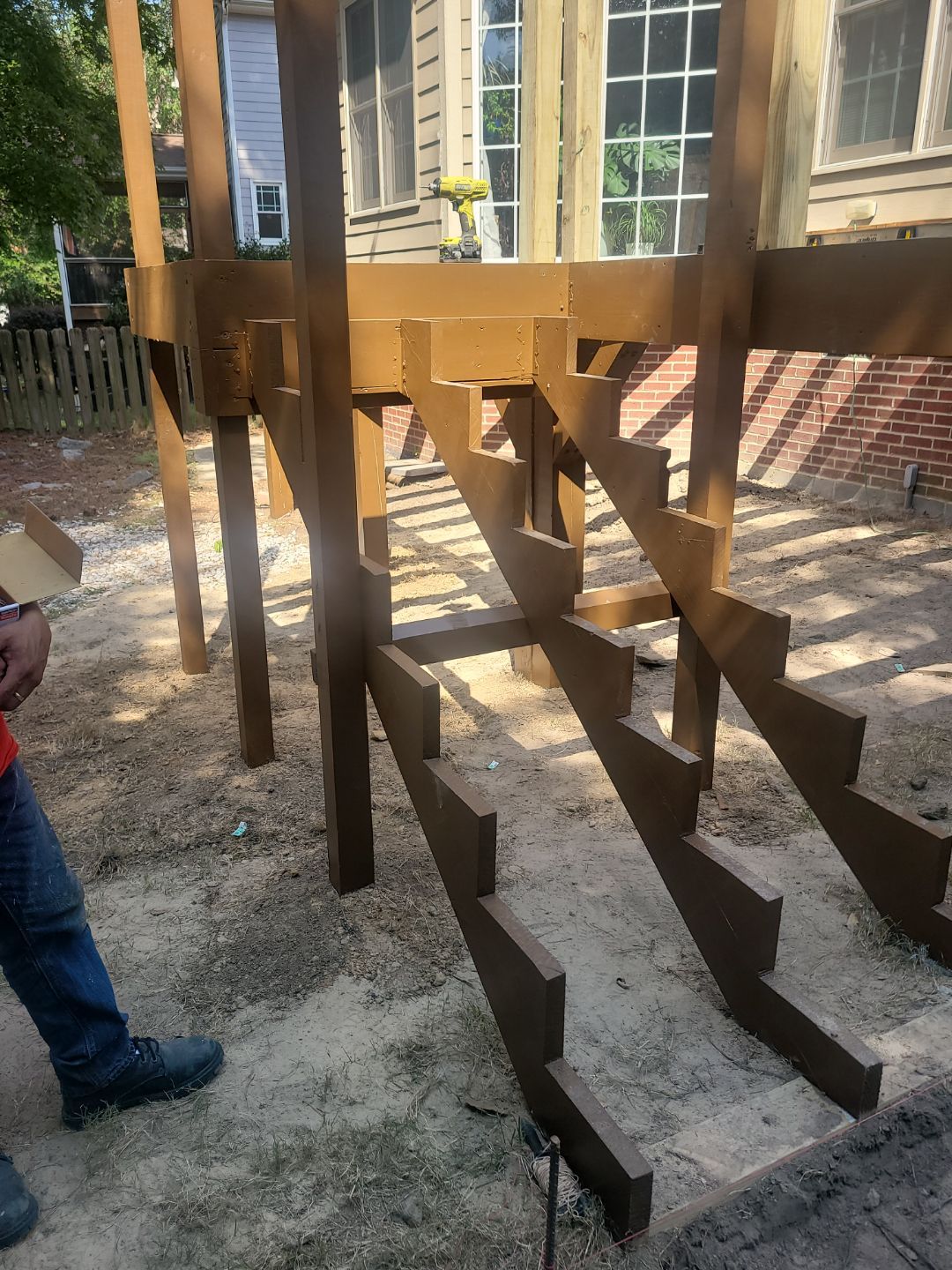 Fuquay-Varina Outdoor Upgrade – Composite Deck & Paved Landing by Elite Remodeling and Design LLC