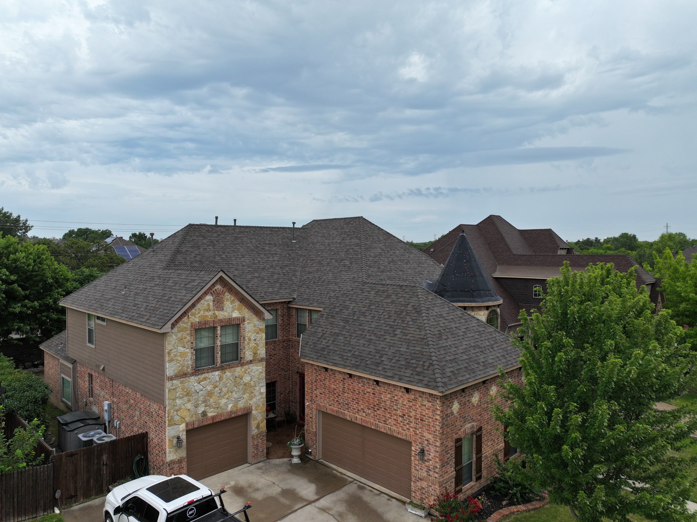 Installing Custom copper turret and Malarkey Vista Class 4 shingles Hail Damage Upgrade by Becker Roofing and Exteriors