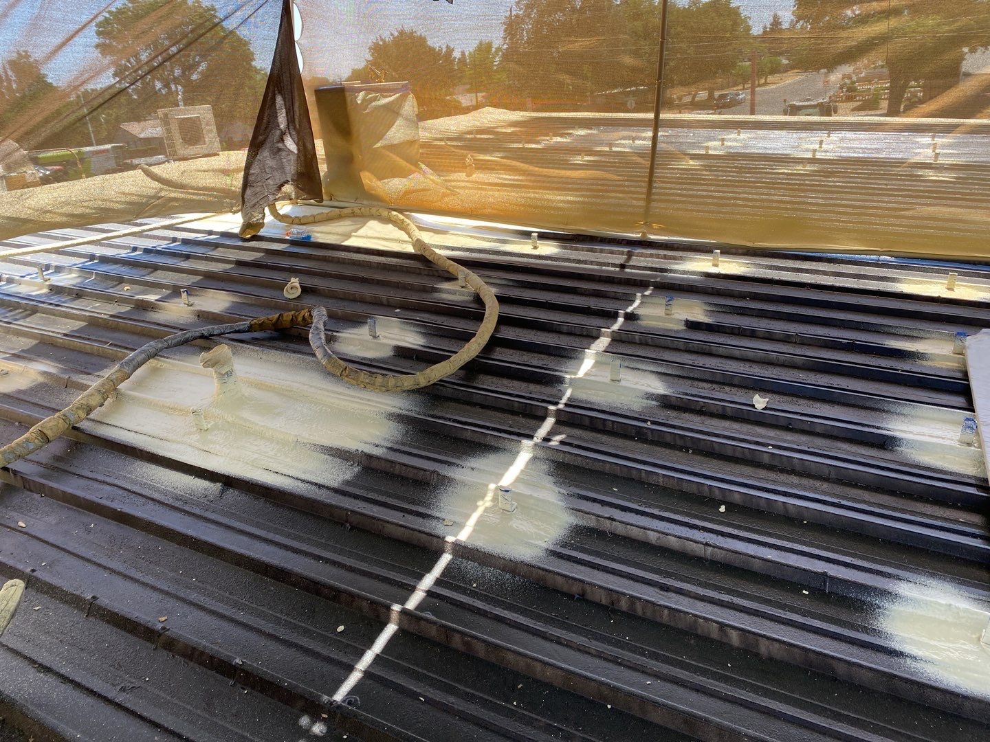 Spray foam and coatings using Conklin Benchmark/PUMA XL coatings and spray foam by Straight Edge Roofing Inc