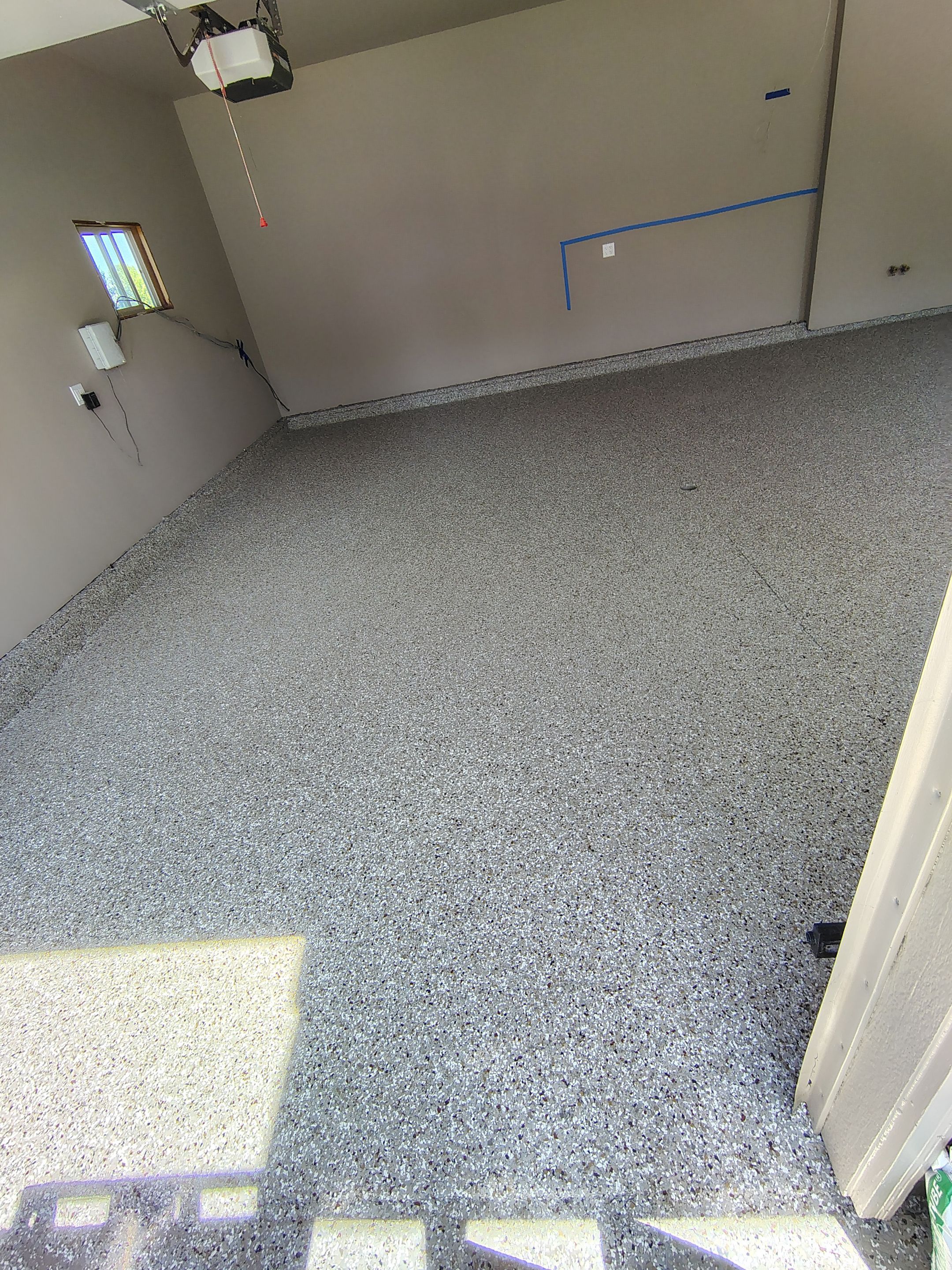 Sioux Falls Garage Concrete Repair and Epoxy Flake Floor Coating by Select Painting, Coatings & Garage Cabinets