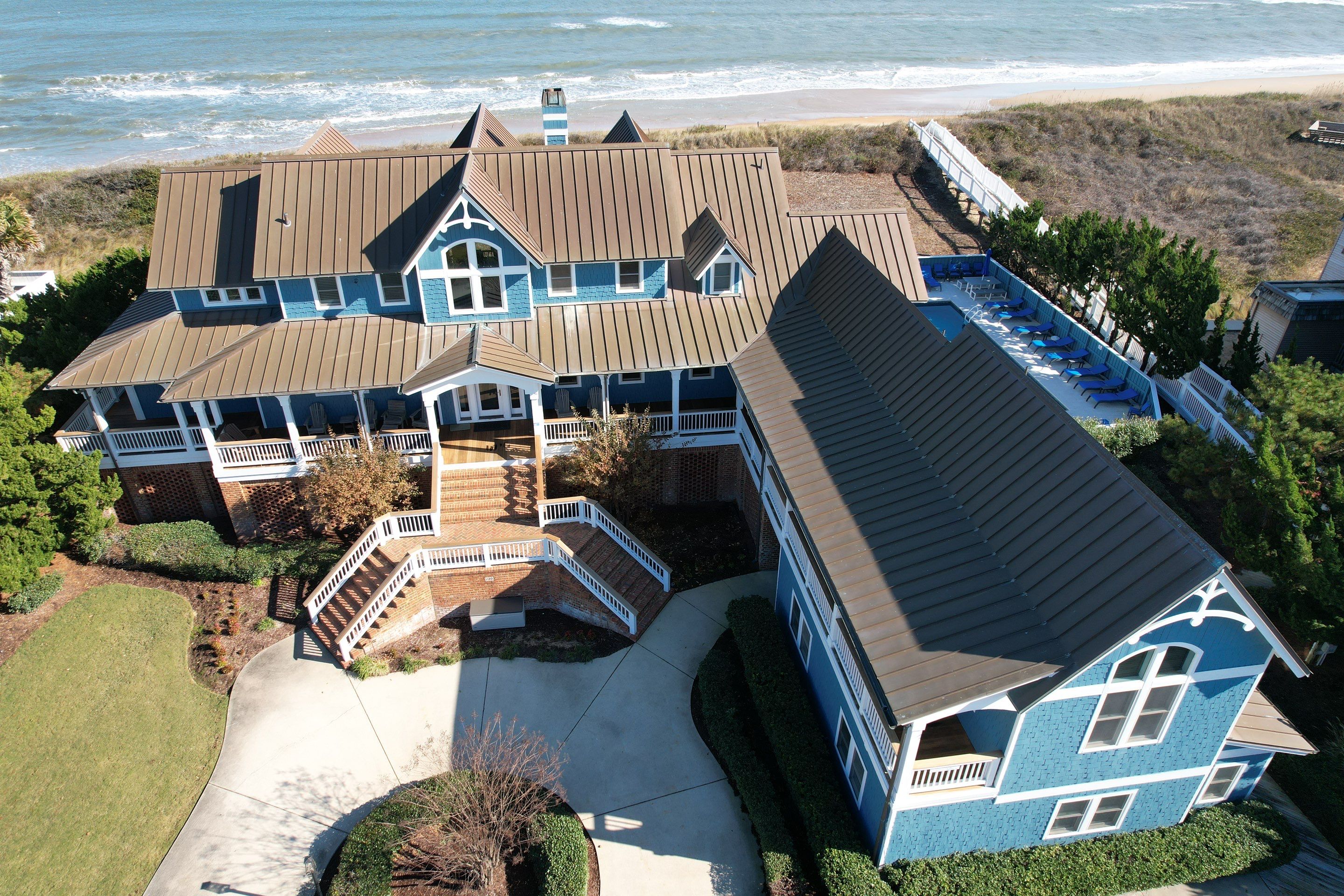 Large Metal Roof Transformation by Gallop Roofing & Remodeling, Inc.
