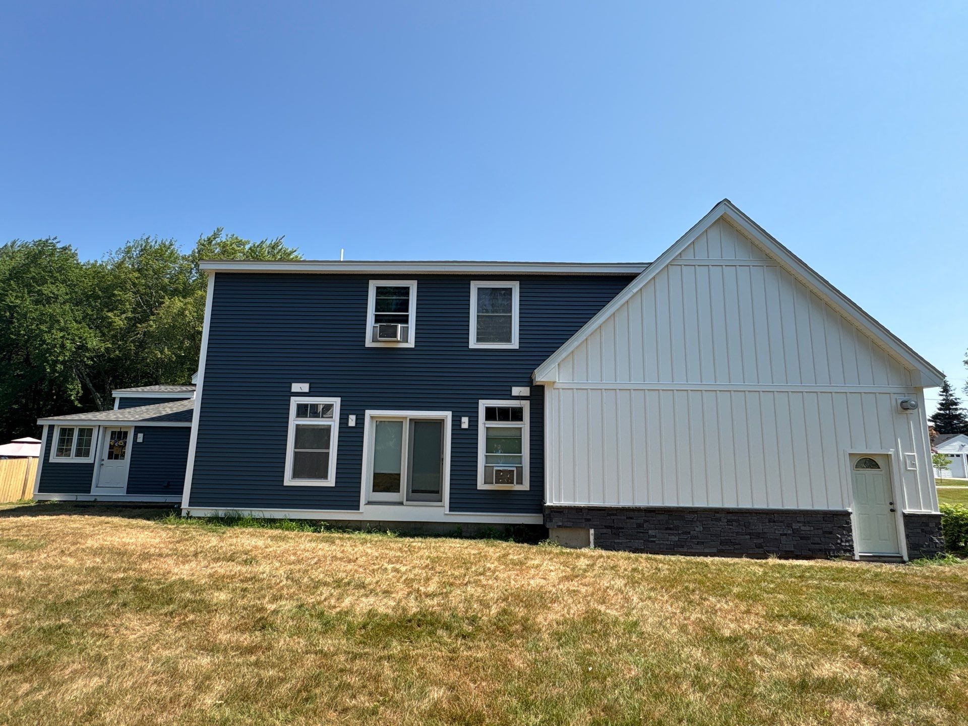Premium Mixed-Material Siding Installation in North Billerica, MA by Mighty Dog Roofing of Greater Middlesex County