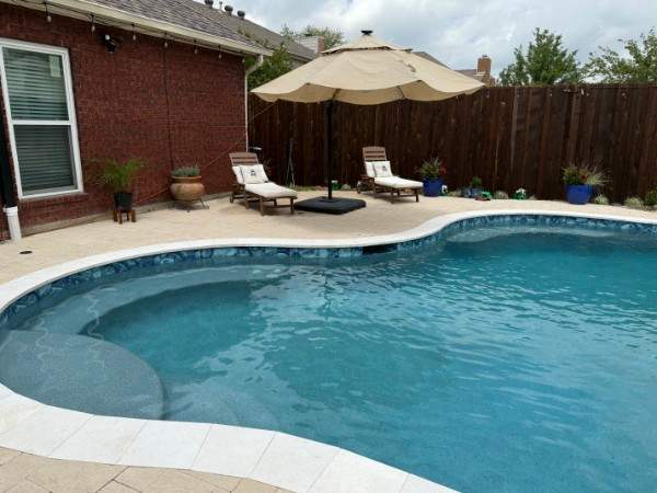 Resort-Style Freeform Pool with Travertine Decking by Pinnacle Pools and Spas - DFW