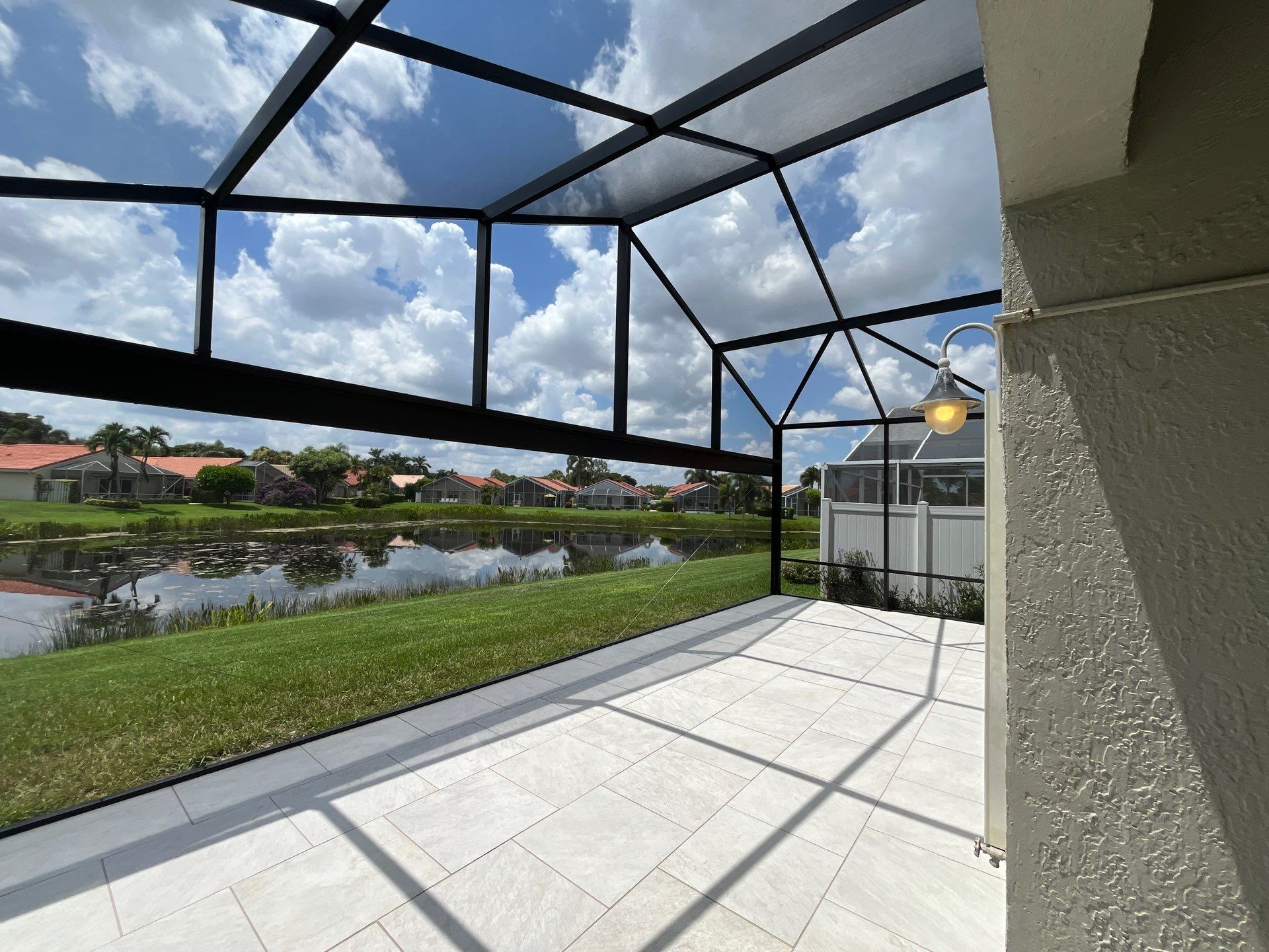 Porcelain Paver Patio and Screen Enclosure Installation in Boynton Beach by The Screen Depot, Inc