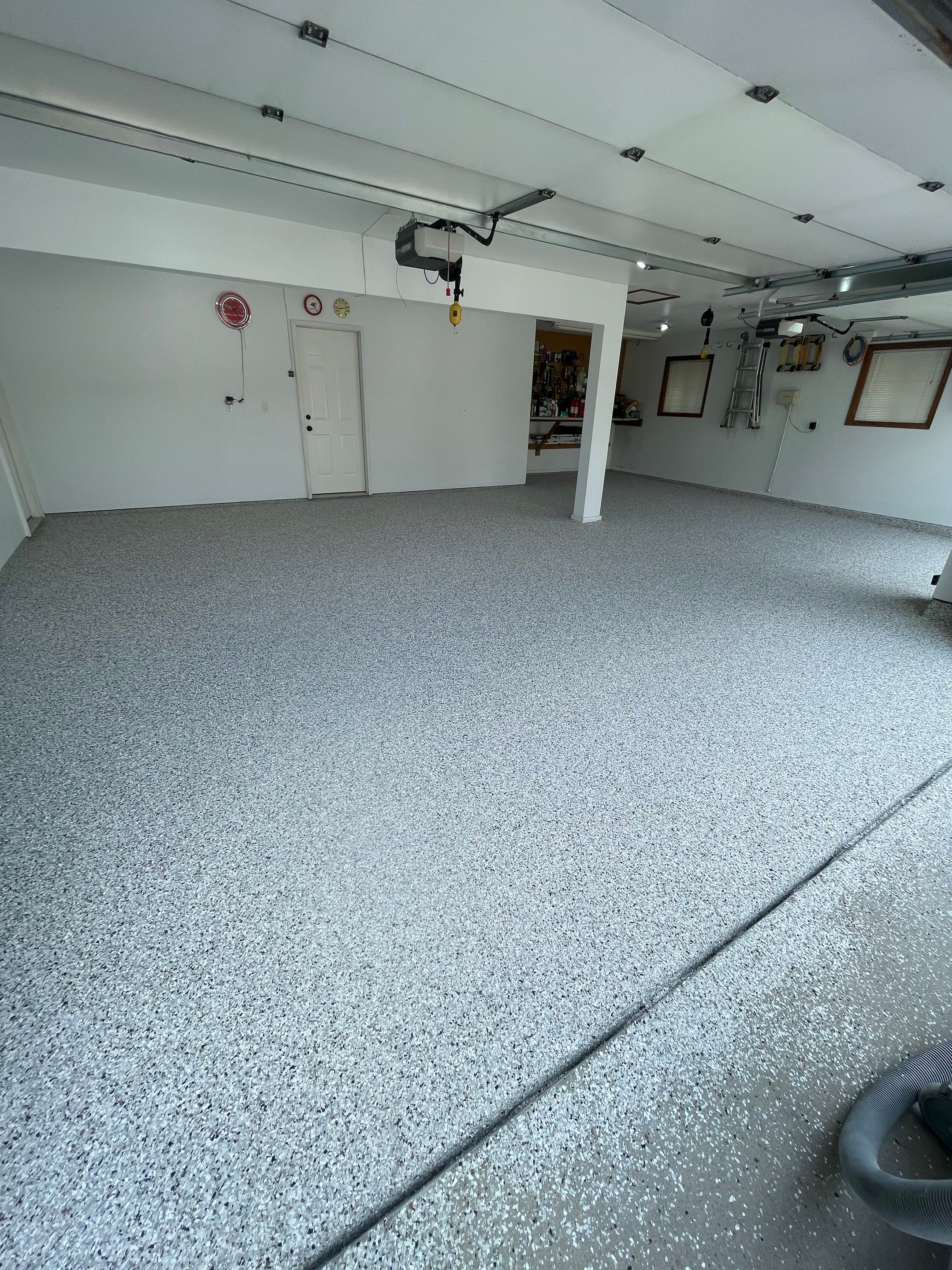 Multi-Car Garage Concrete Coating with Coyote Flake Finish in Sioux Falls by Select Painting, Coatings & Garage Cabinets