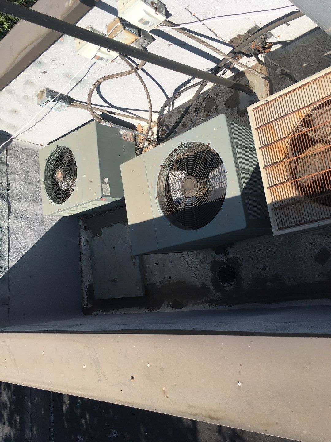Spray foam and coatings inside commercial building HVAC well using Spray foam and coatings over existing BUR system by Straight Edge Roofing Inc