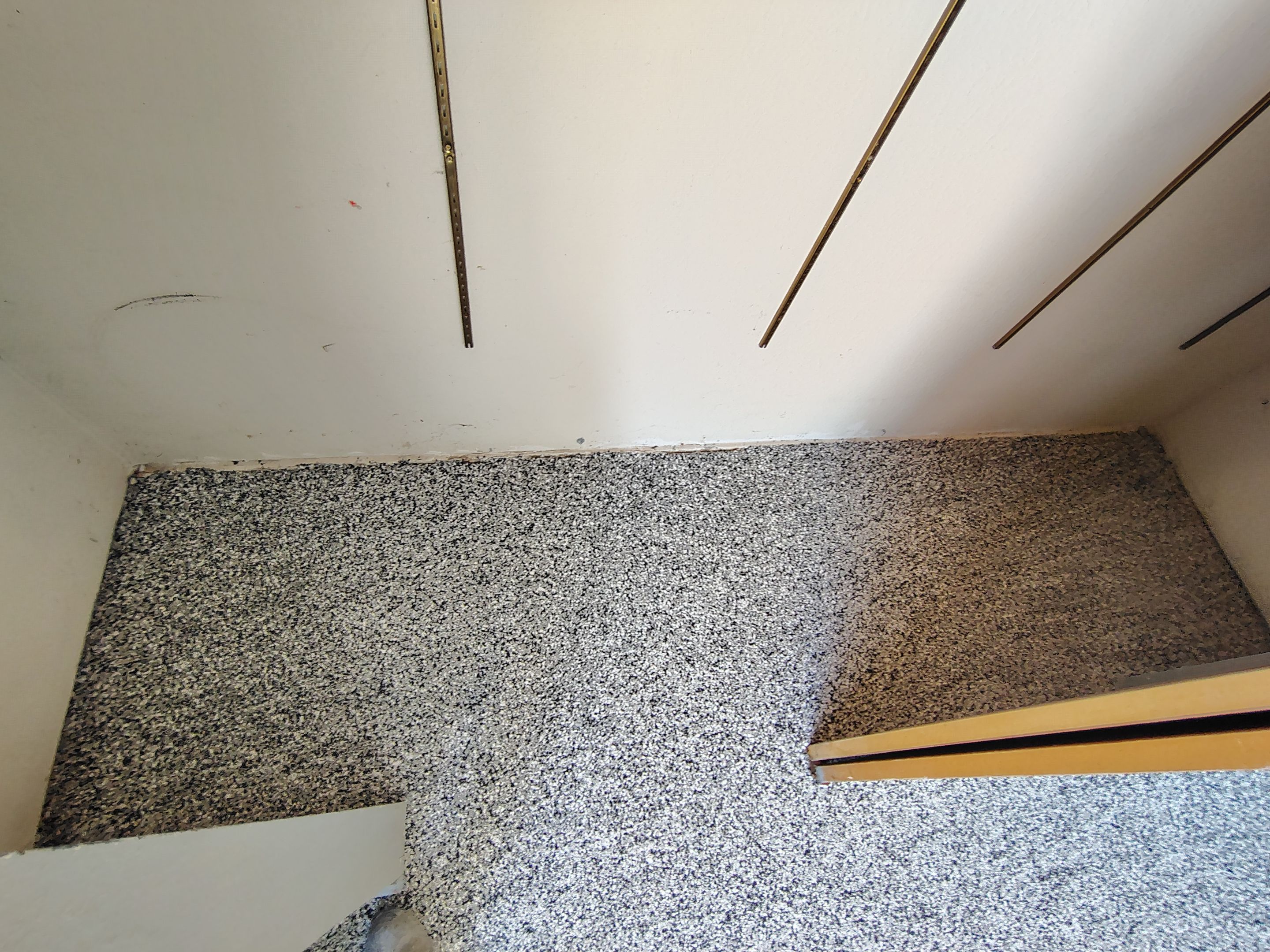 Domino Flake Garage Floor Coating Installation in Sioux Falls by Select Painting, Coatings & Garage Cabinets